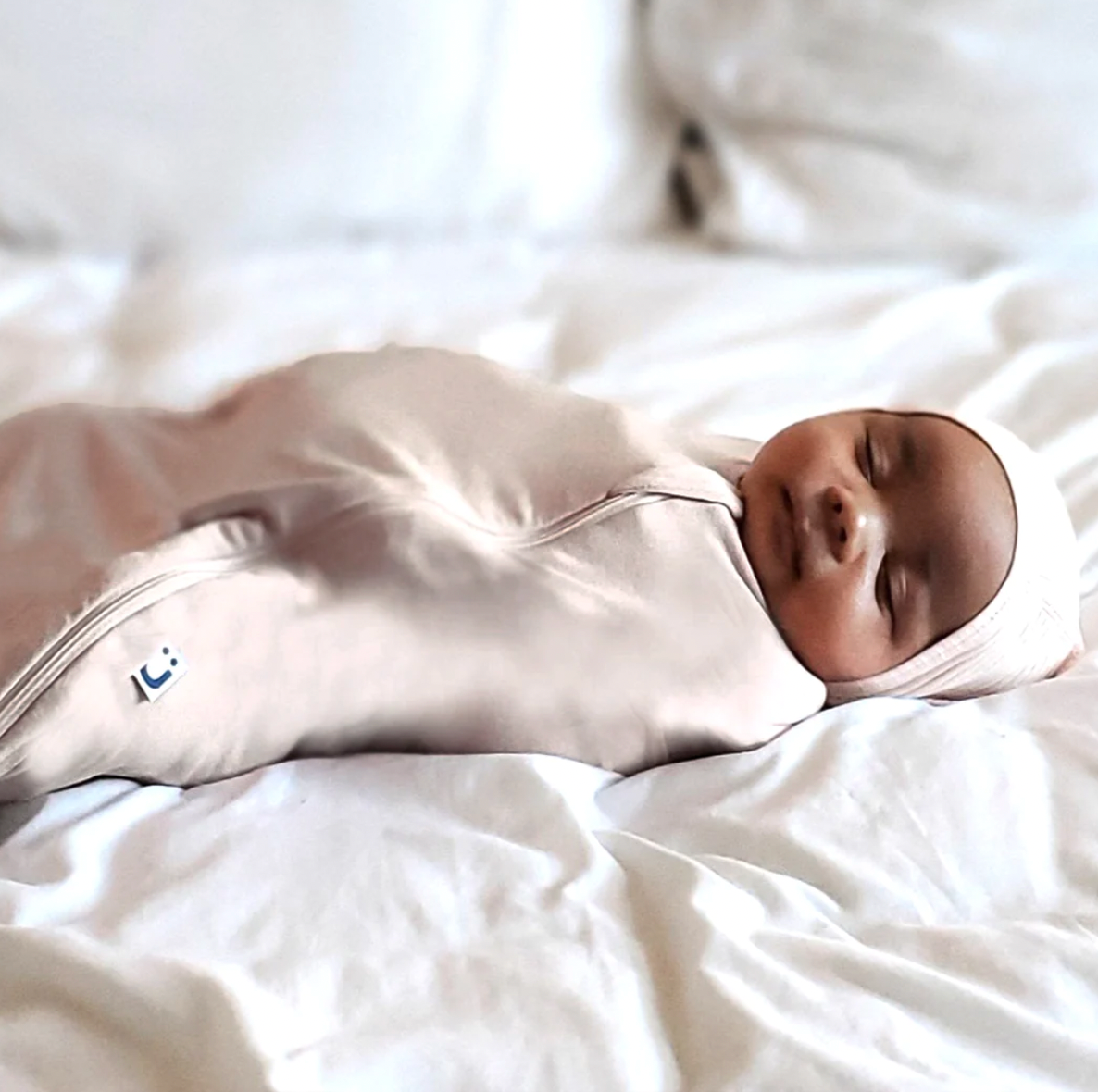 Should You Swaddle Your Baby's Arms Down or Across Their Chest?