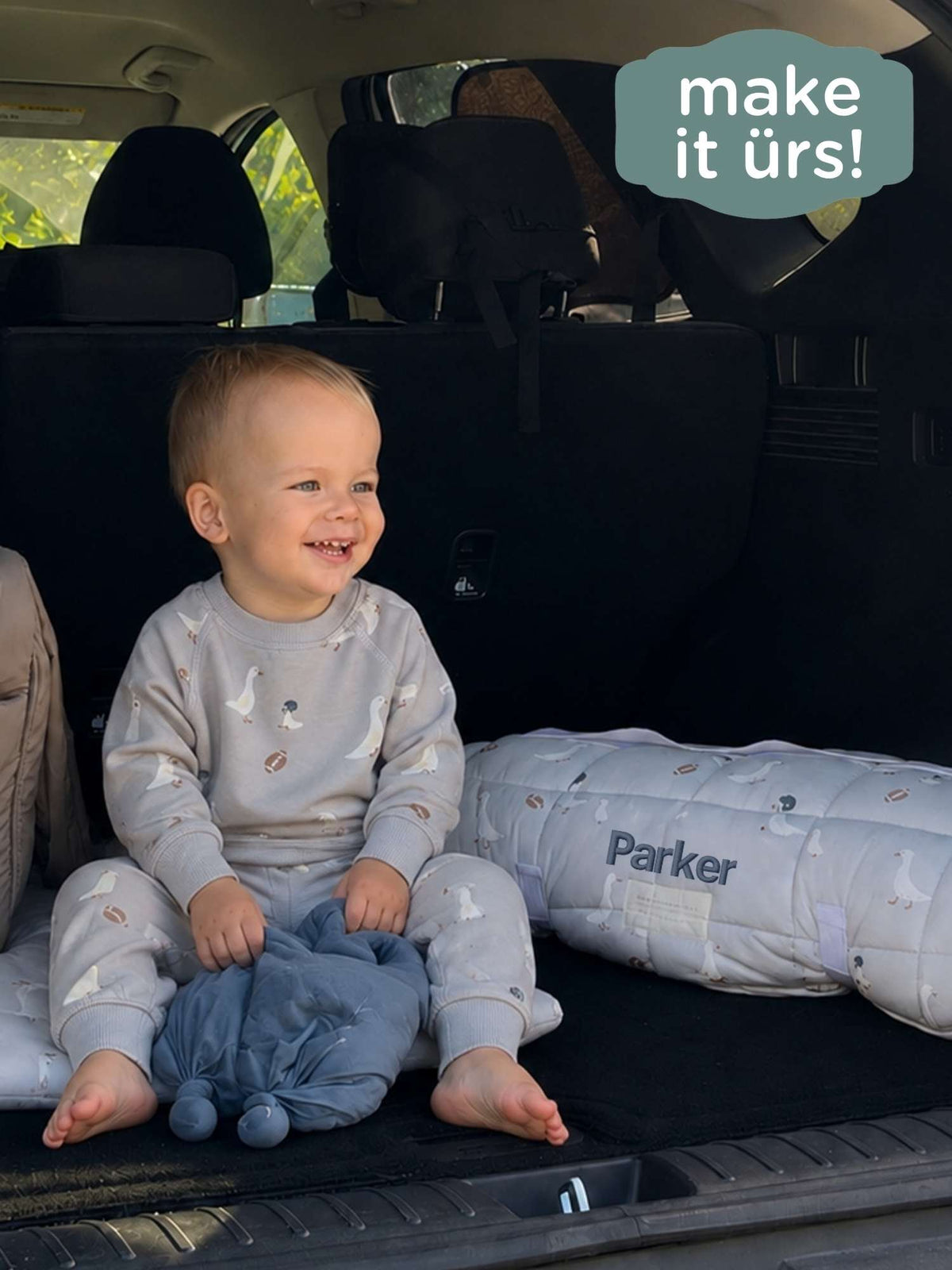 Gray quilted nap mat with goose pattern and 'Parker' name print on the side