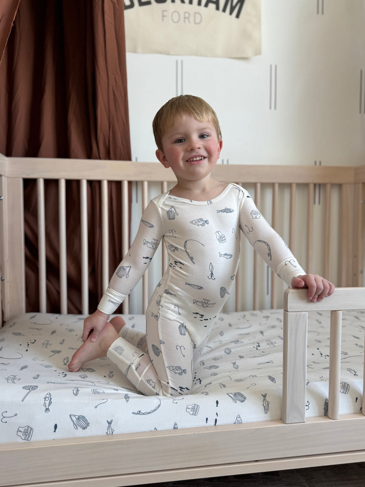 Off-white kids pajama set with long sleeves and fishing-themed print