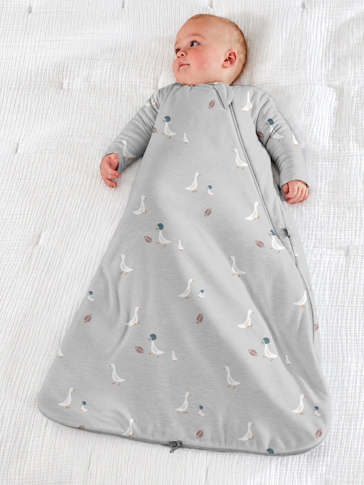 Long-sleeve sleep sack, light gray with all-over goose and football graphics, zip front