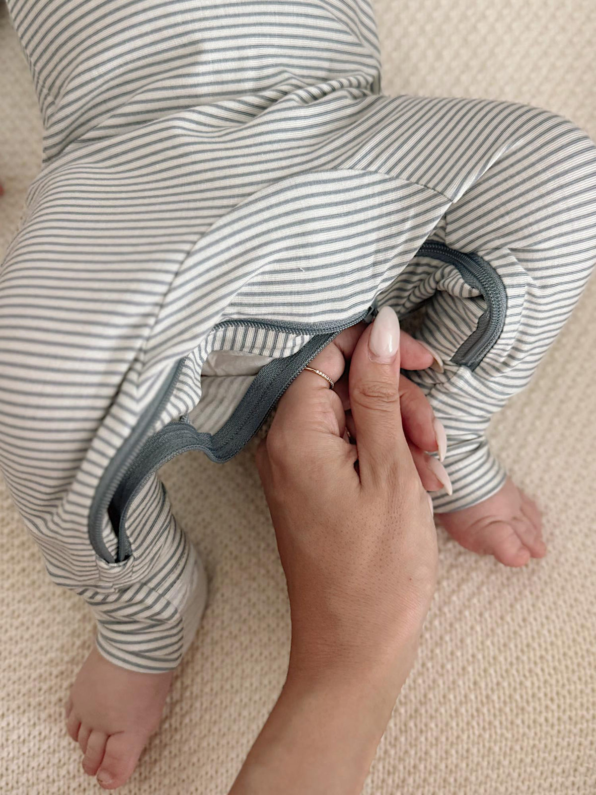 Blue-and-white striped pajama sleeve with foldover cuff and elastic opening
