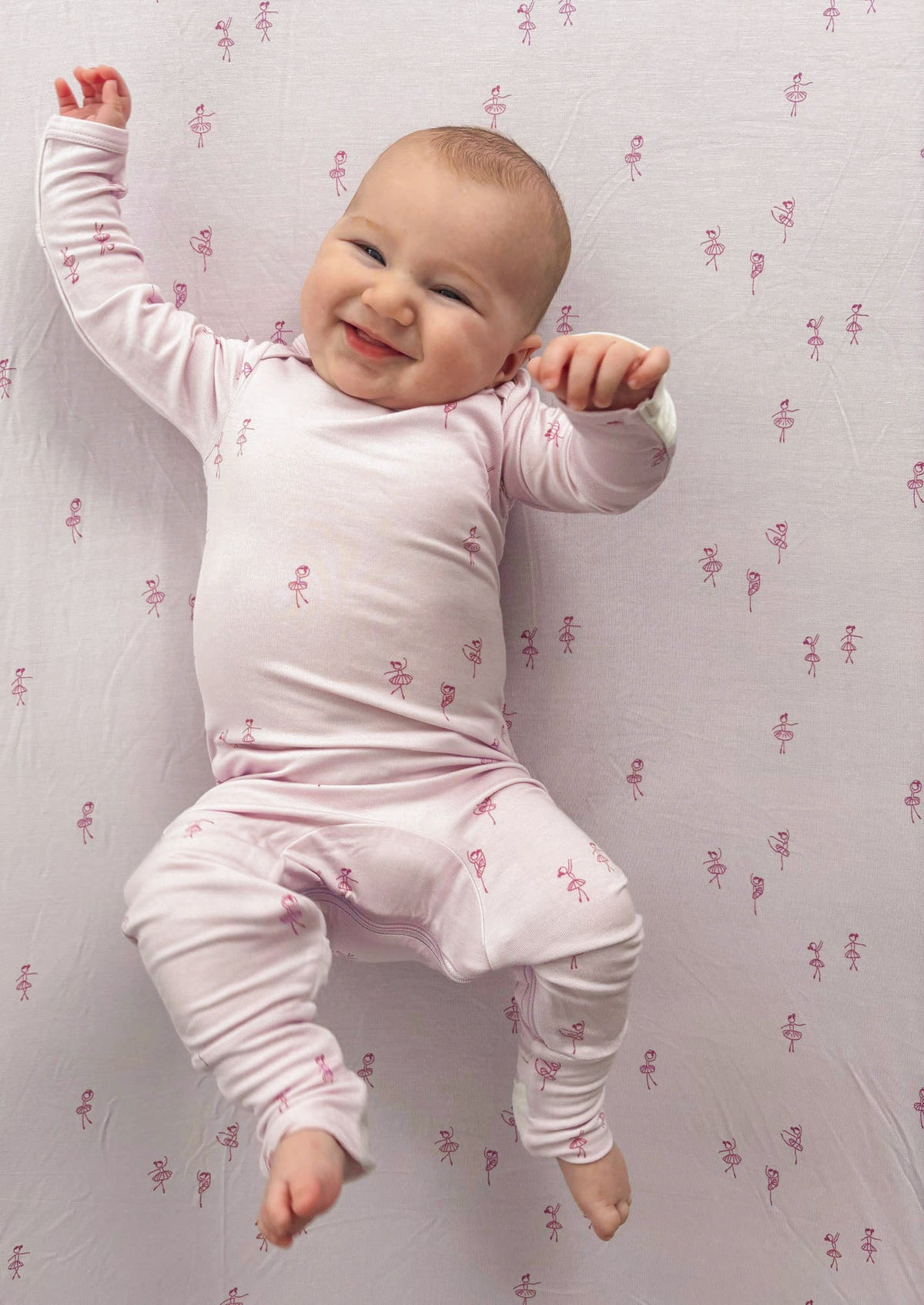 Light pink baby convertible pajama with ballet dancer pattern, long sleeves and footed cuffs