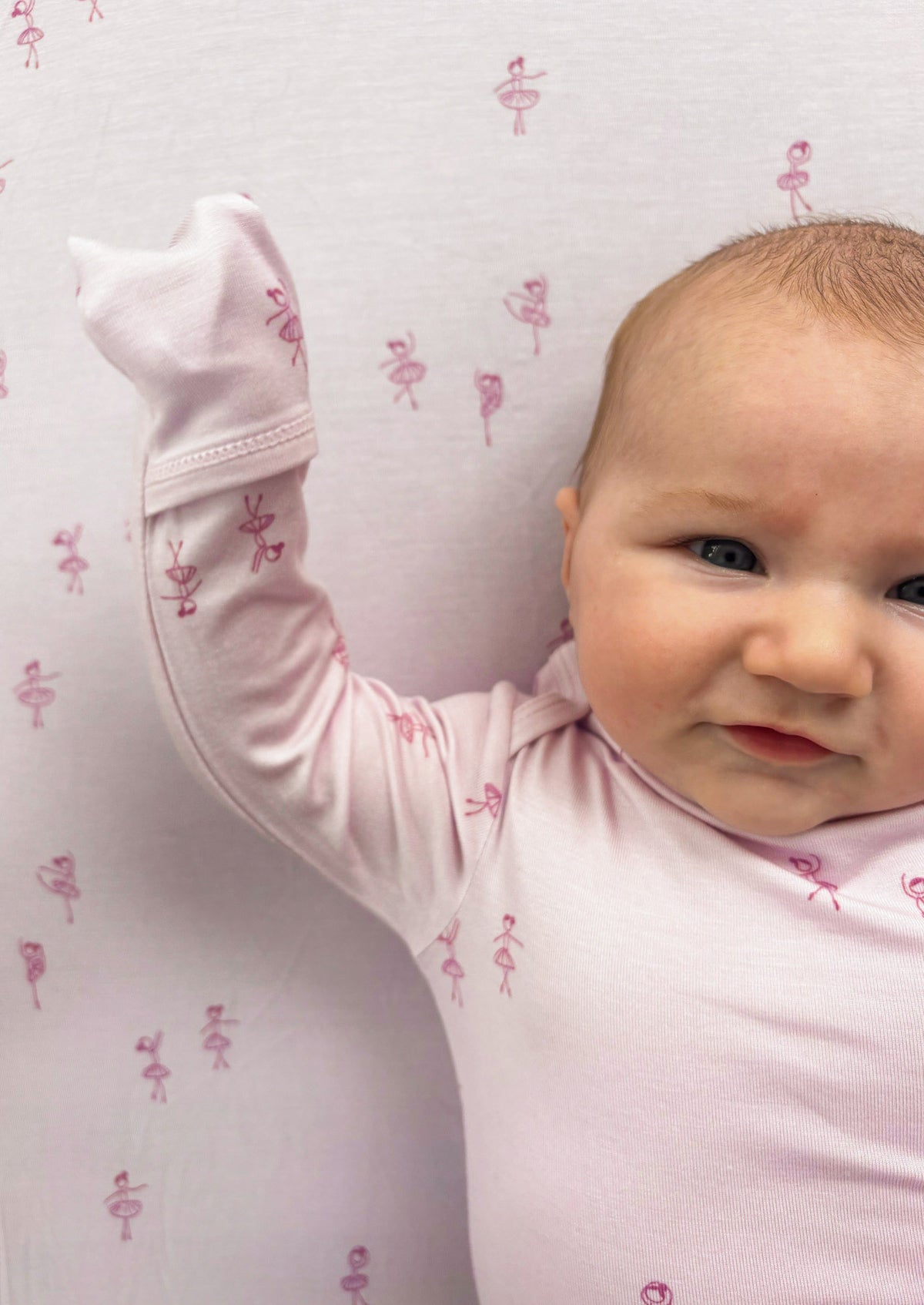 Light pink baby convertible pajama with ballet dancer print, long sleeves and footed legs