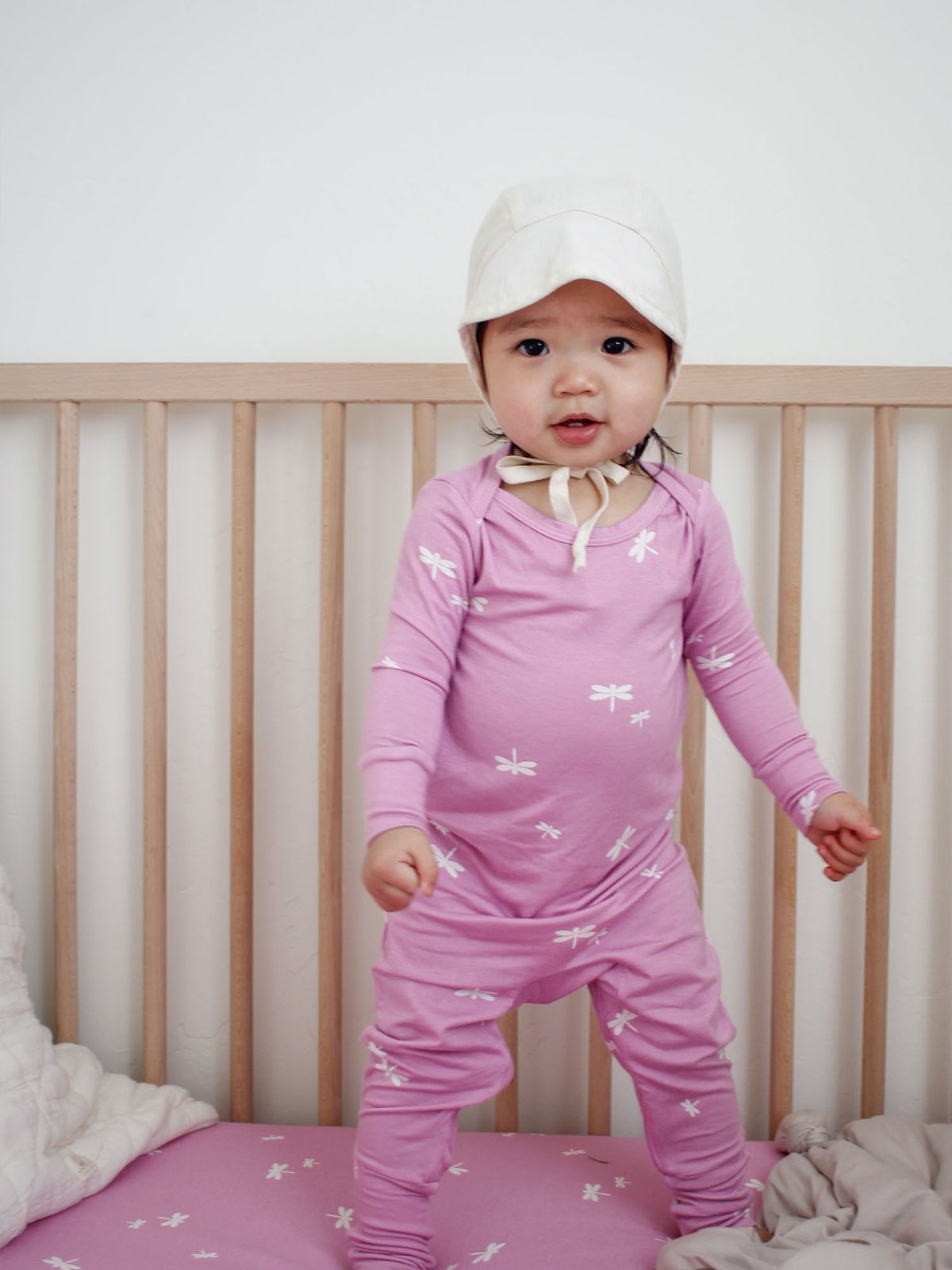 Pink hooded convertible pajama set with long sleeves and allover firefly print