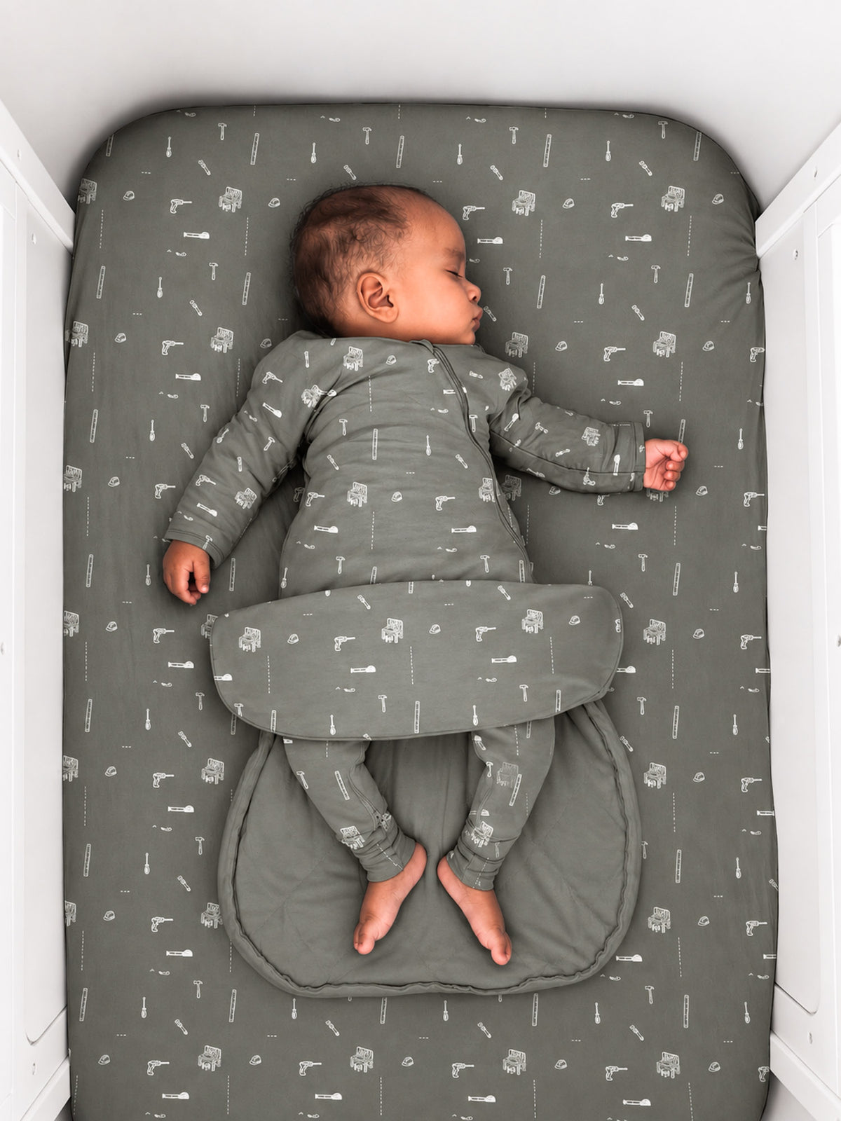 Long sleeve swaddle sack, dark gray with small tool print, 2.5 TOG, open swaddle wings