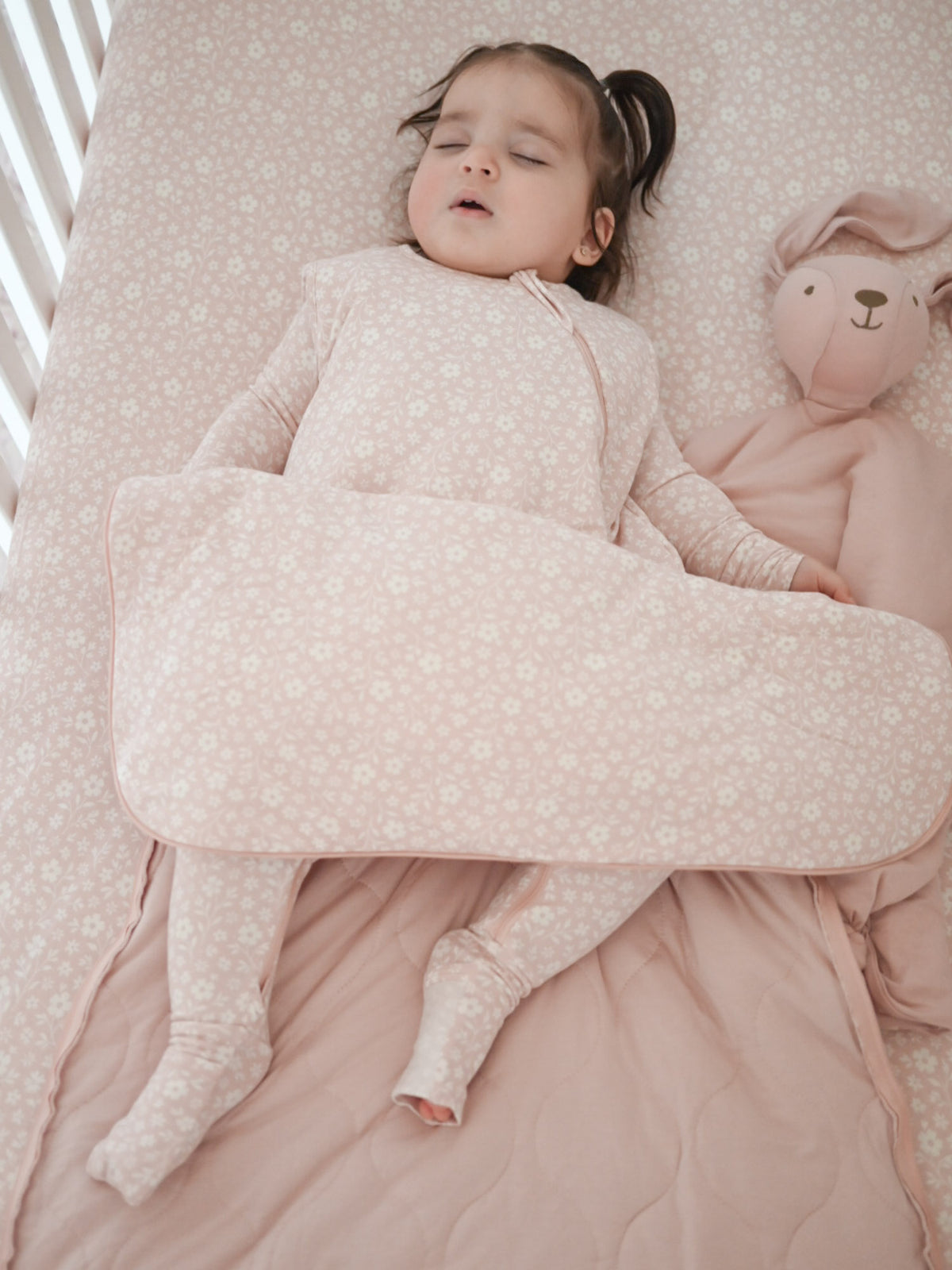 Light pink floral baby sleep sack with long sleeves and covered feet, 1.0 TOG.