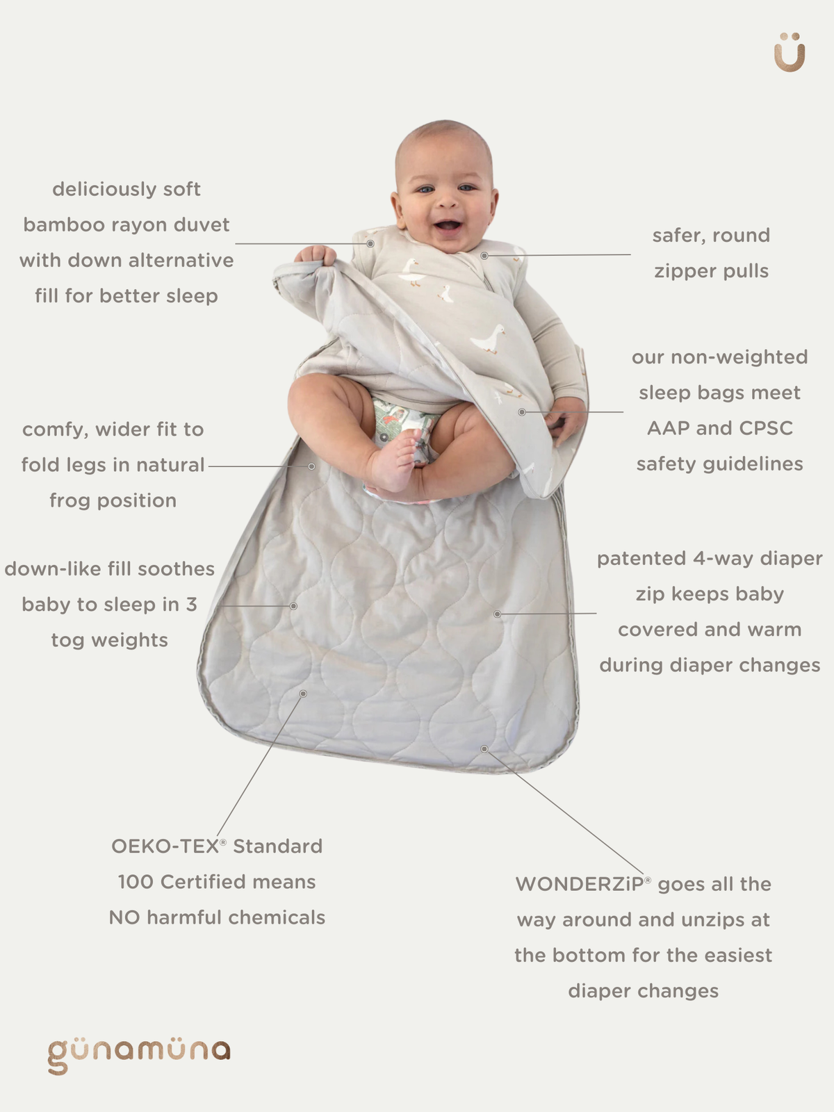 Light cream sleep sack with zipper front and subtle allover pattern.