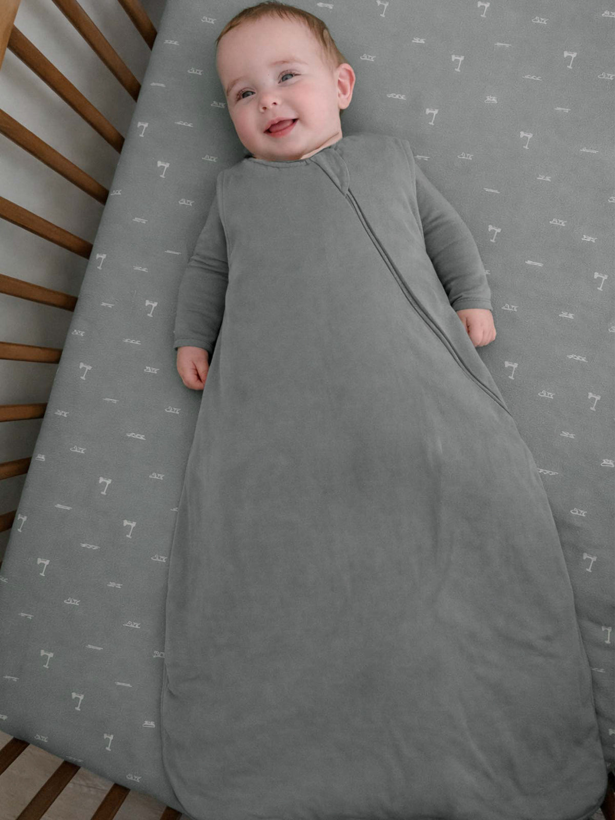 Gray infant sleep sack with full-length zipper and comfy round design