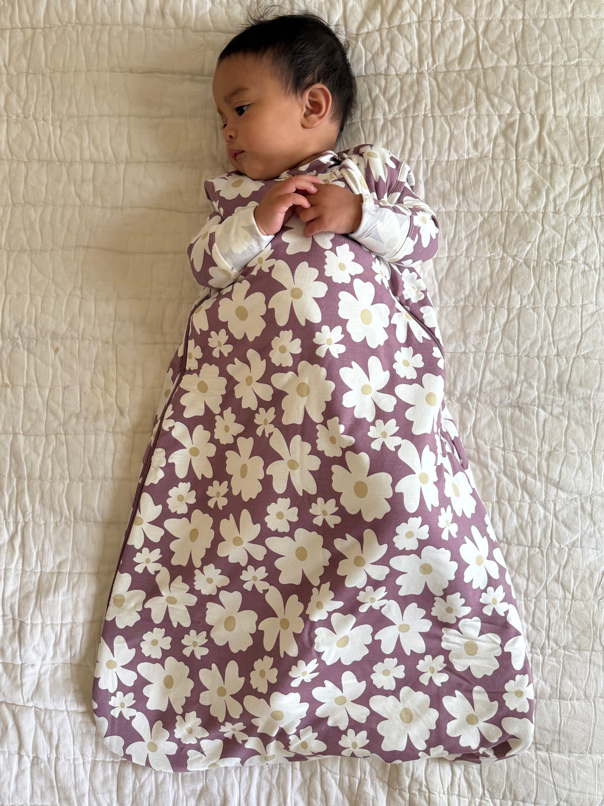Maroon floral baby sleep sack with white flowers, long sleeves and wide bottom