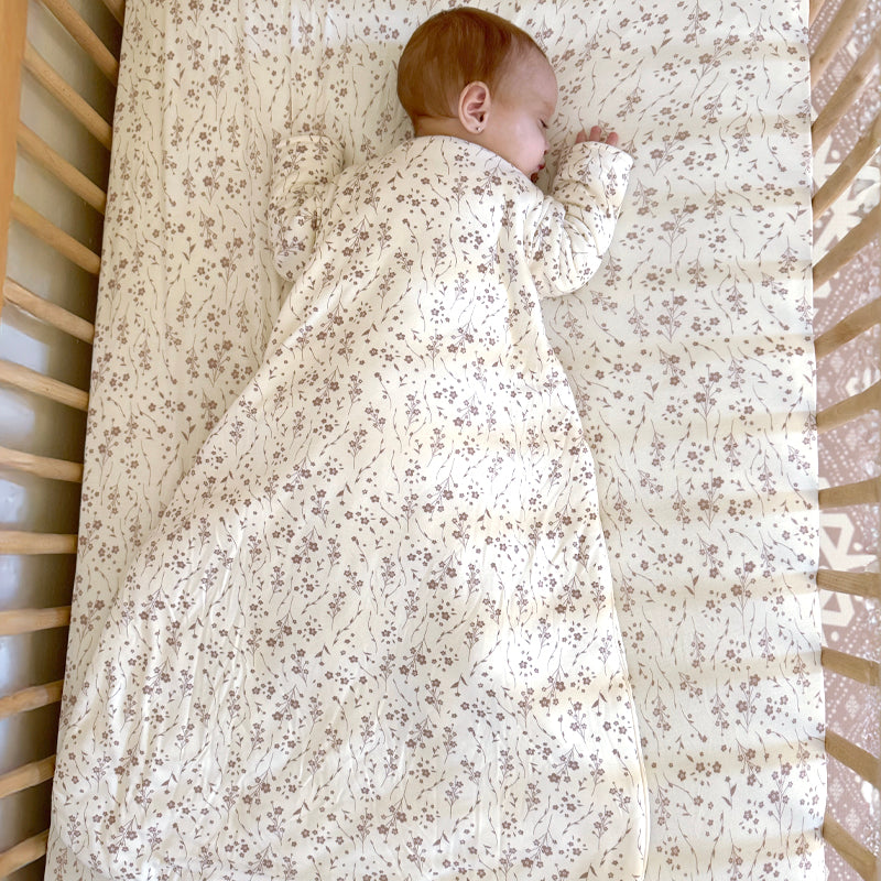 Cream floral long-sleeve sleep sack with front zipper, small brown/purple flowers