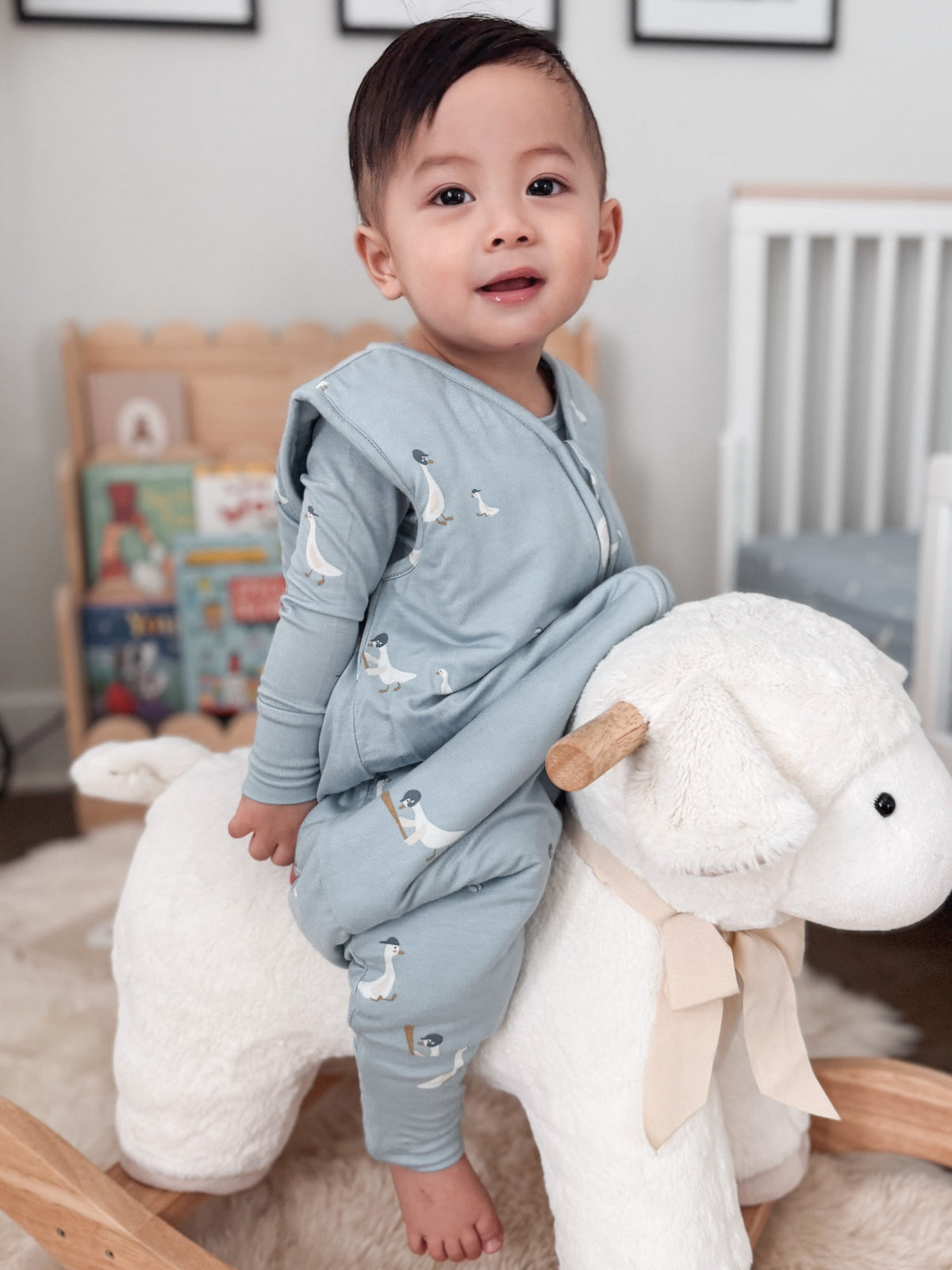 Footie sleep sack light blue with swan print and zip hood, footed legs