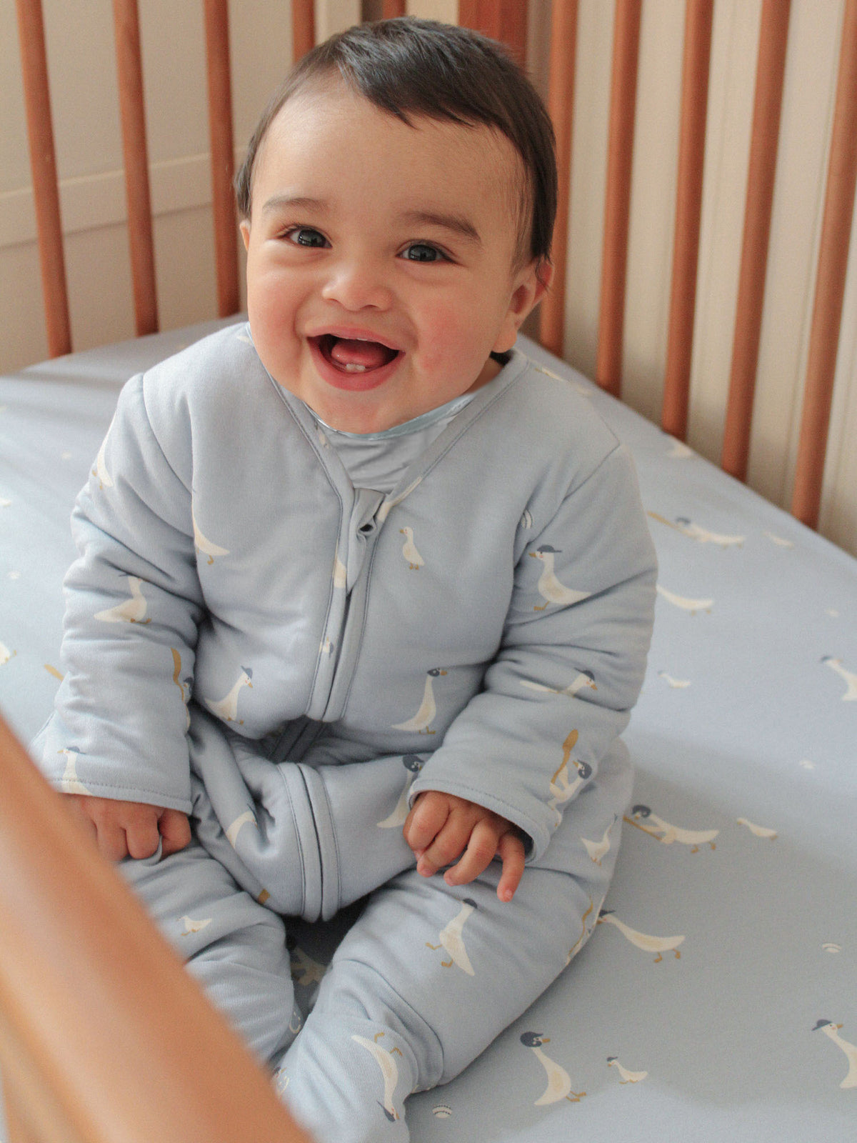 Light blue footie sleep sack with bird print and zip-front, long sleeves