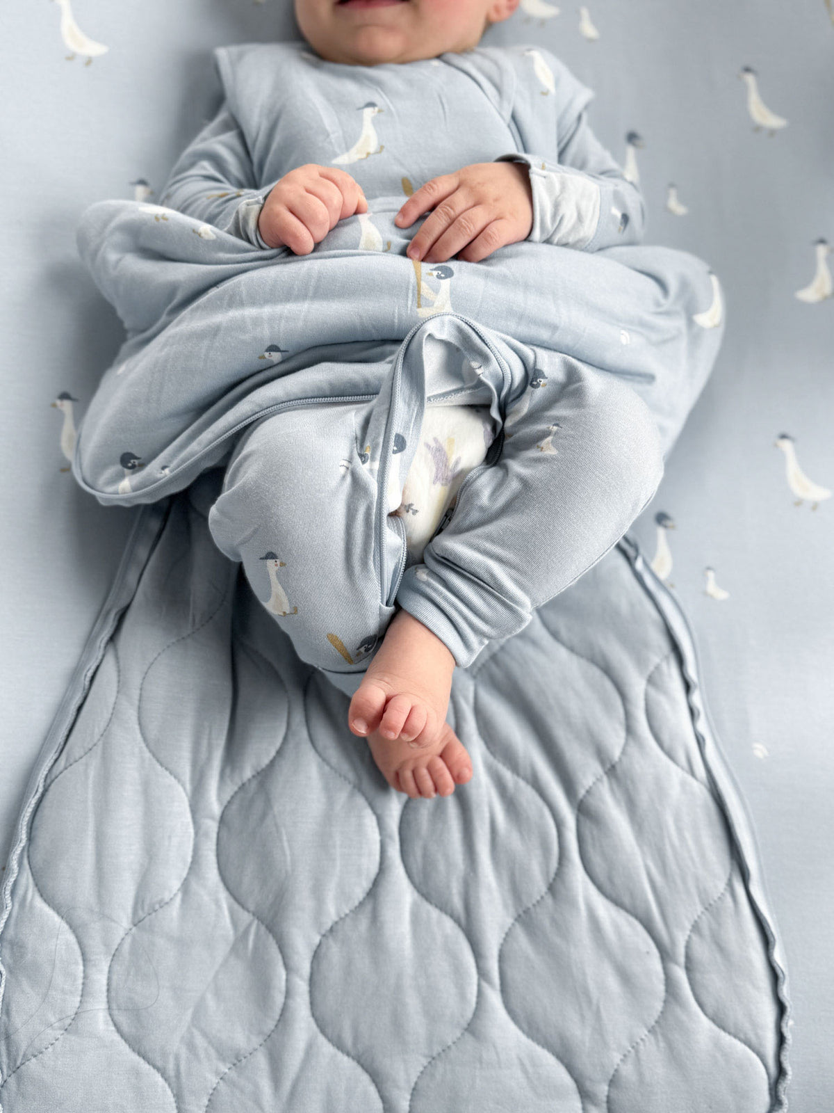 Light blue quilted goose-print sleep sack with zip front and foot opening, 1.0 TOG