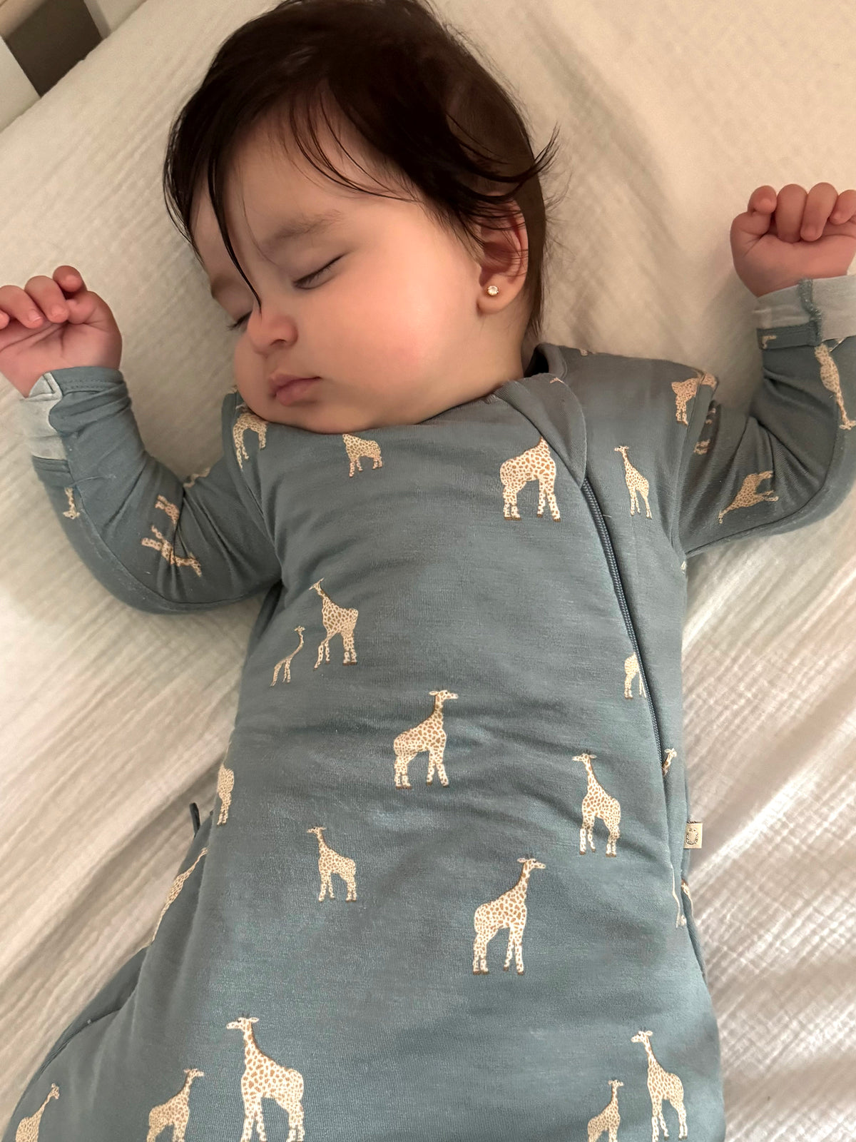 Moss green swaddle sleep sack with giraffe print, zip front, long sleeves