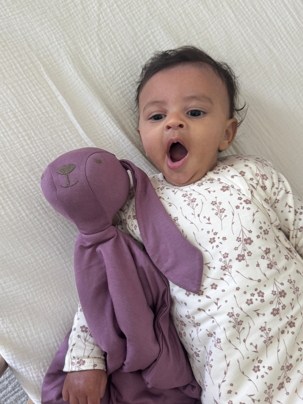 2.5 TOG transitional swaddle sleep sack, floral print, baby swaddled with hands raised
