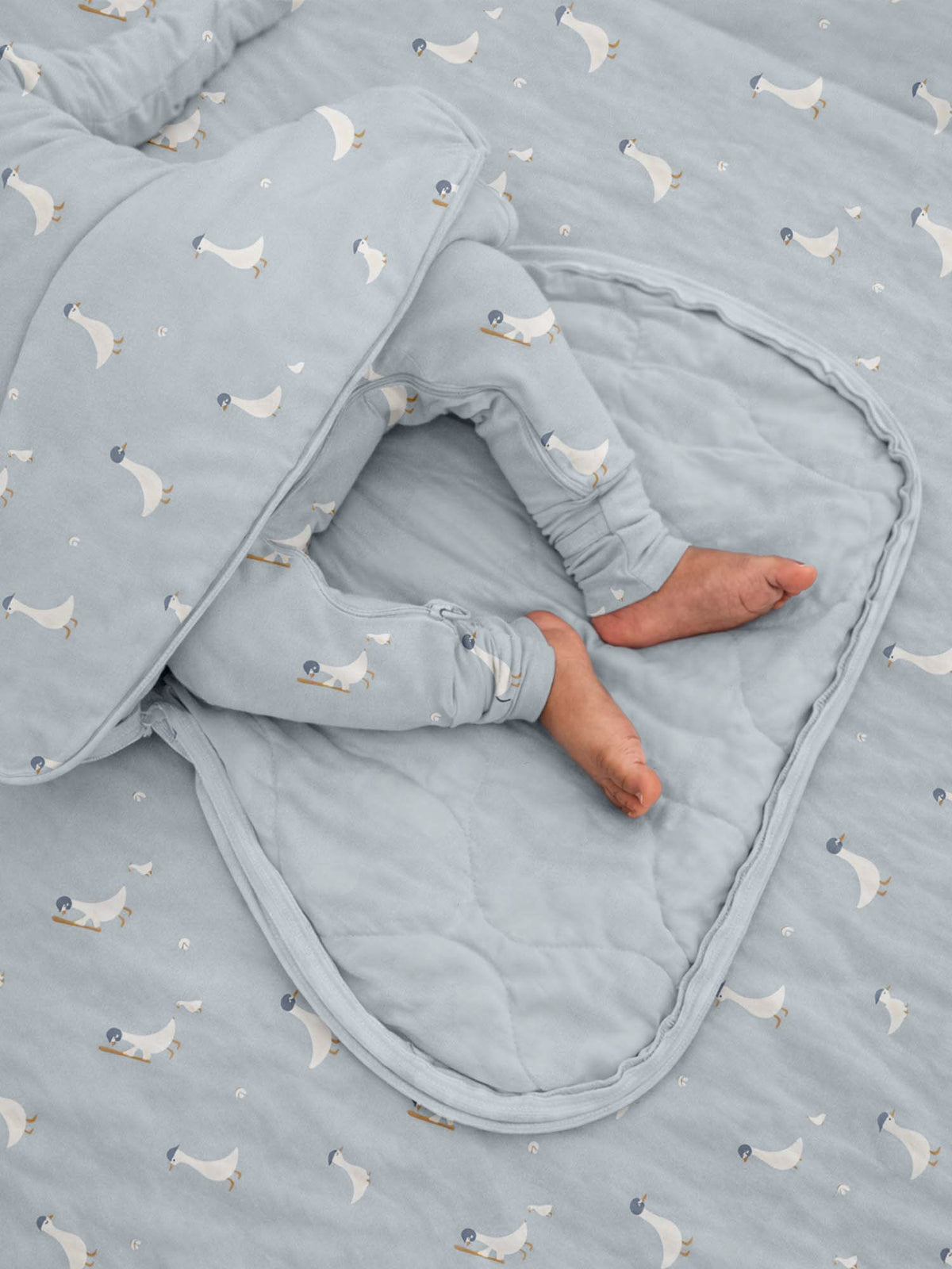 Light blue long-sleeve swaddle sack with baseball goose print, open bottom wrap