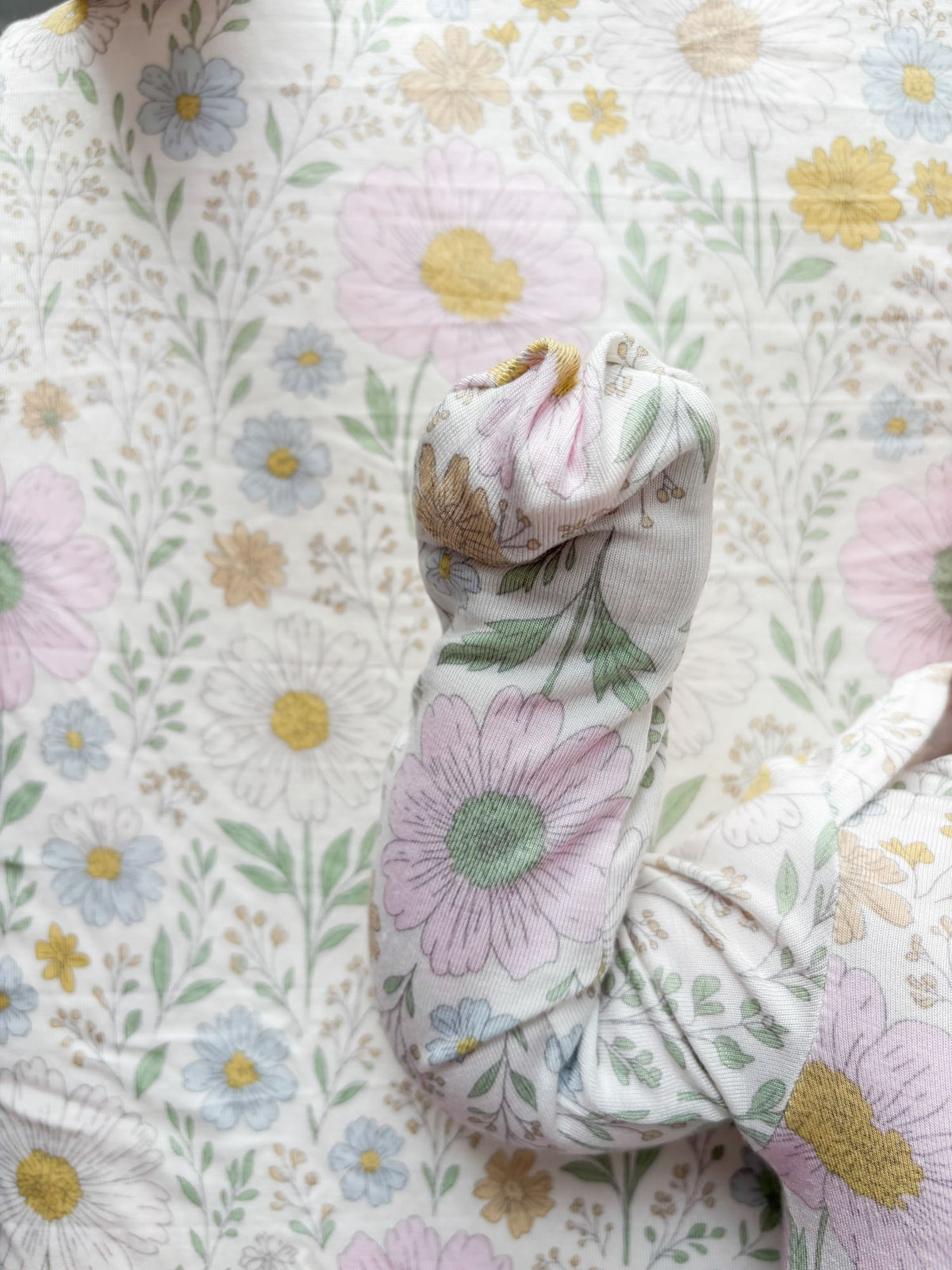 Pastel wildflower-print convertible pajama with attached mittens and hood detail