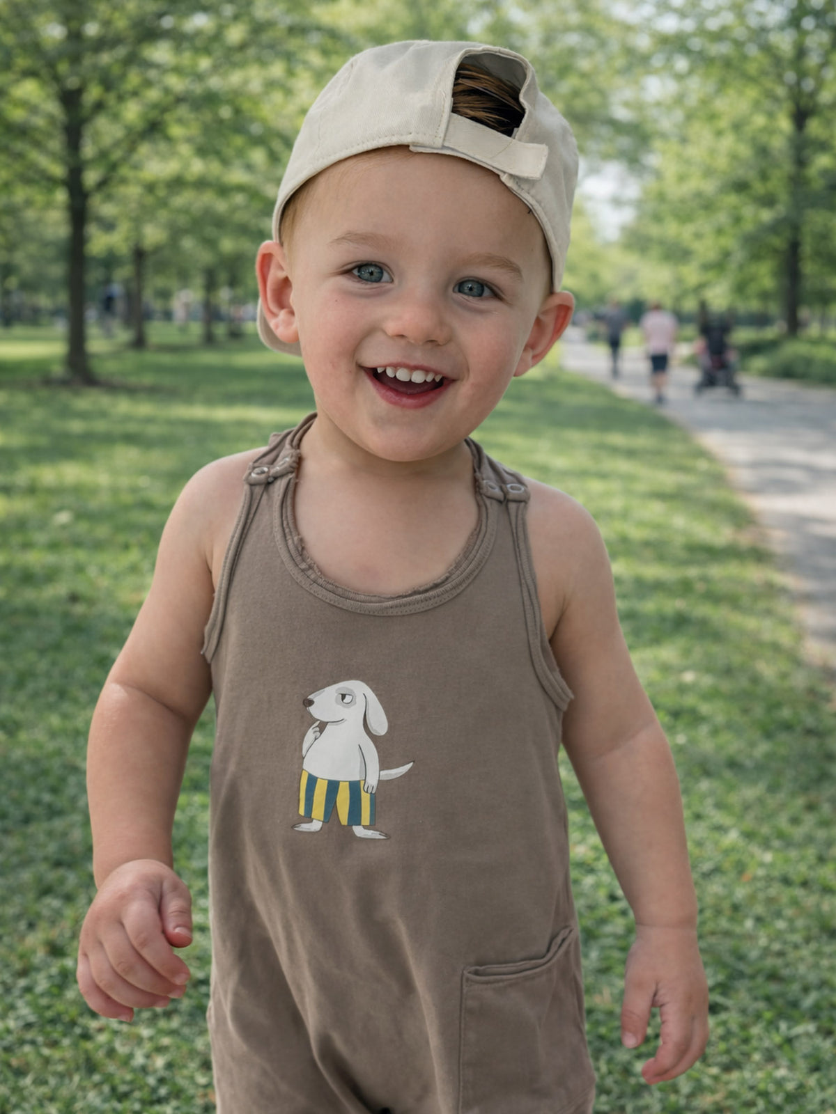 Kids' taupe tank romper with dog front graphic and side pocket