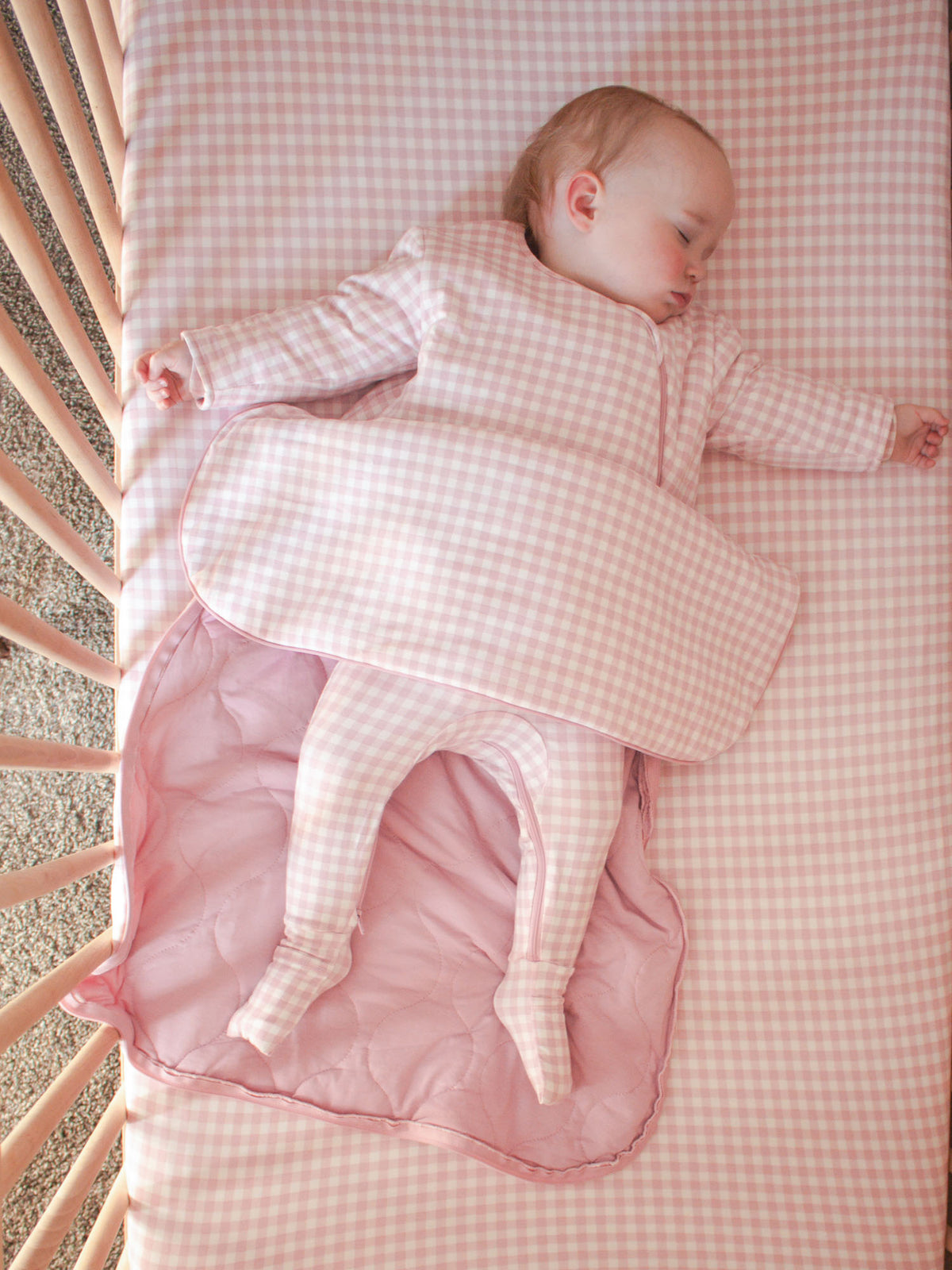 Pink gingham long-sleeve sleep sack with front zipper and tucked shoulder cuffs