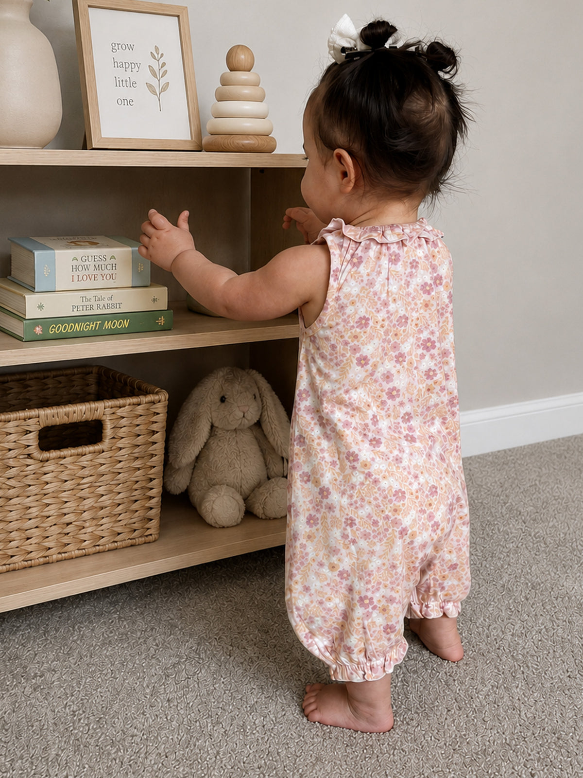Peach-pink floral bubble romper with ruffled collar, toddler sleeveless one-piece