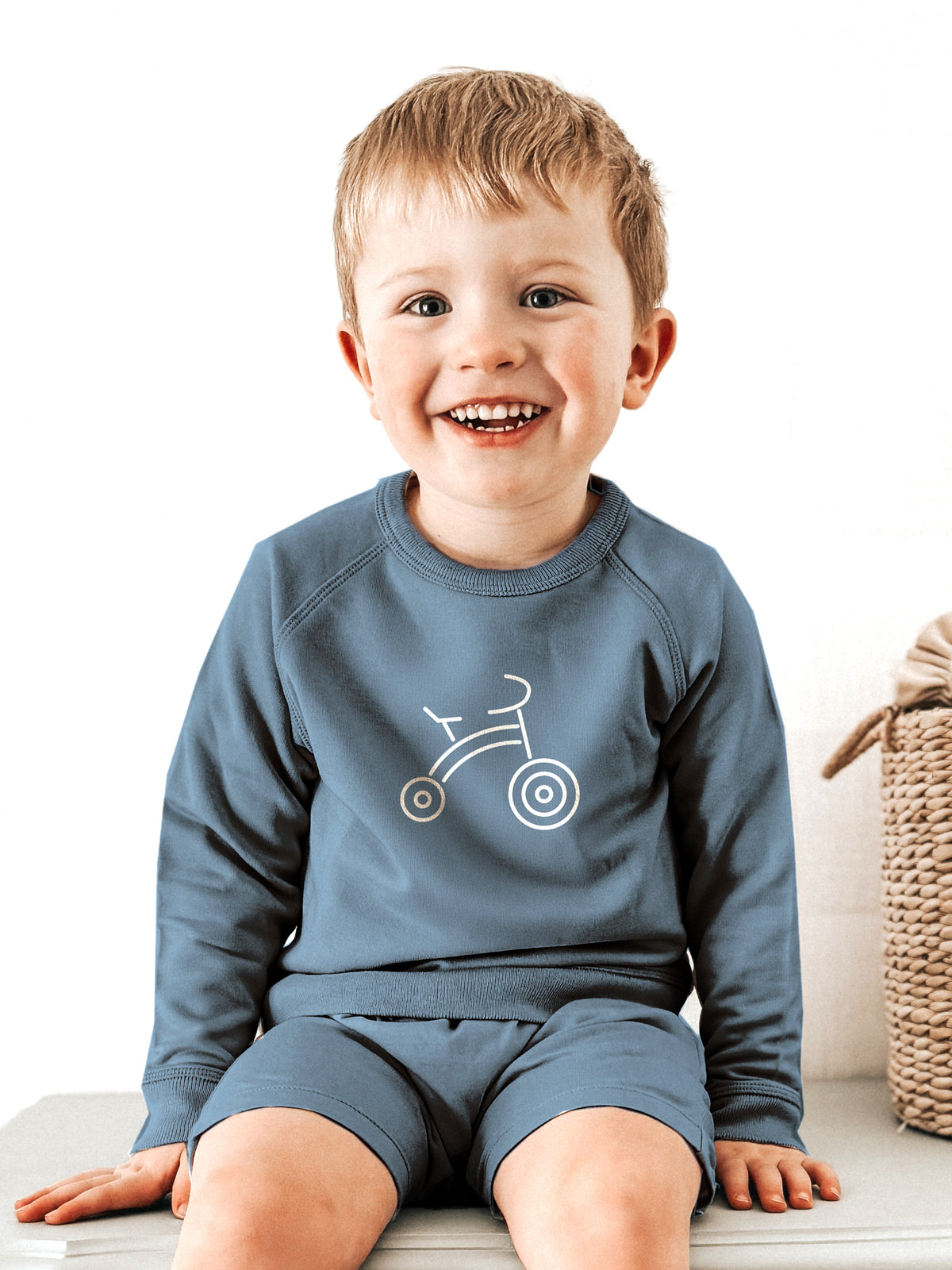 Kids blue crewneck sweatshirt with white bike graphic