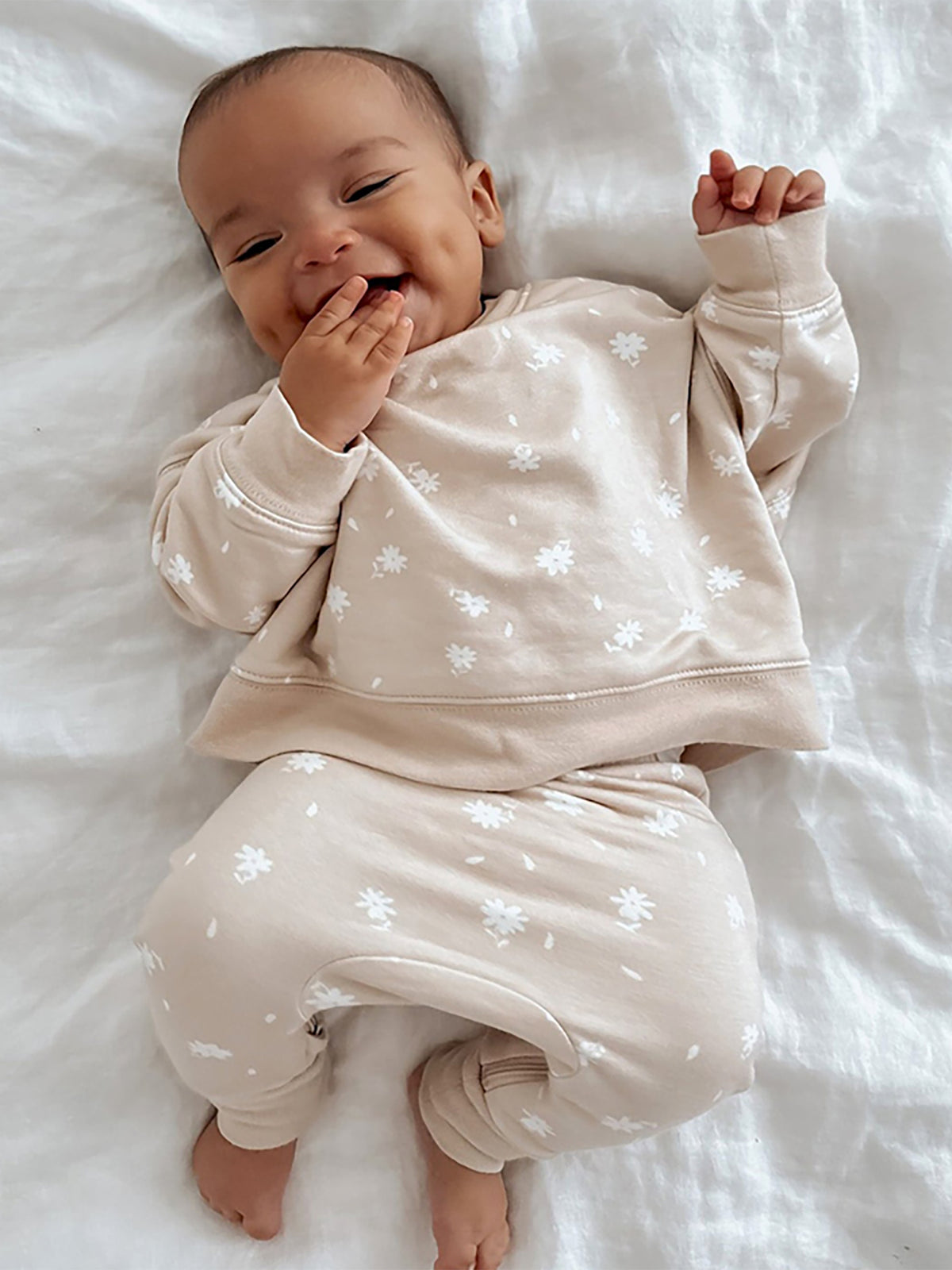 Light blush fleece sweatsuit set with white flower print, long sleeves and matching pants