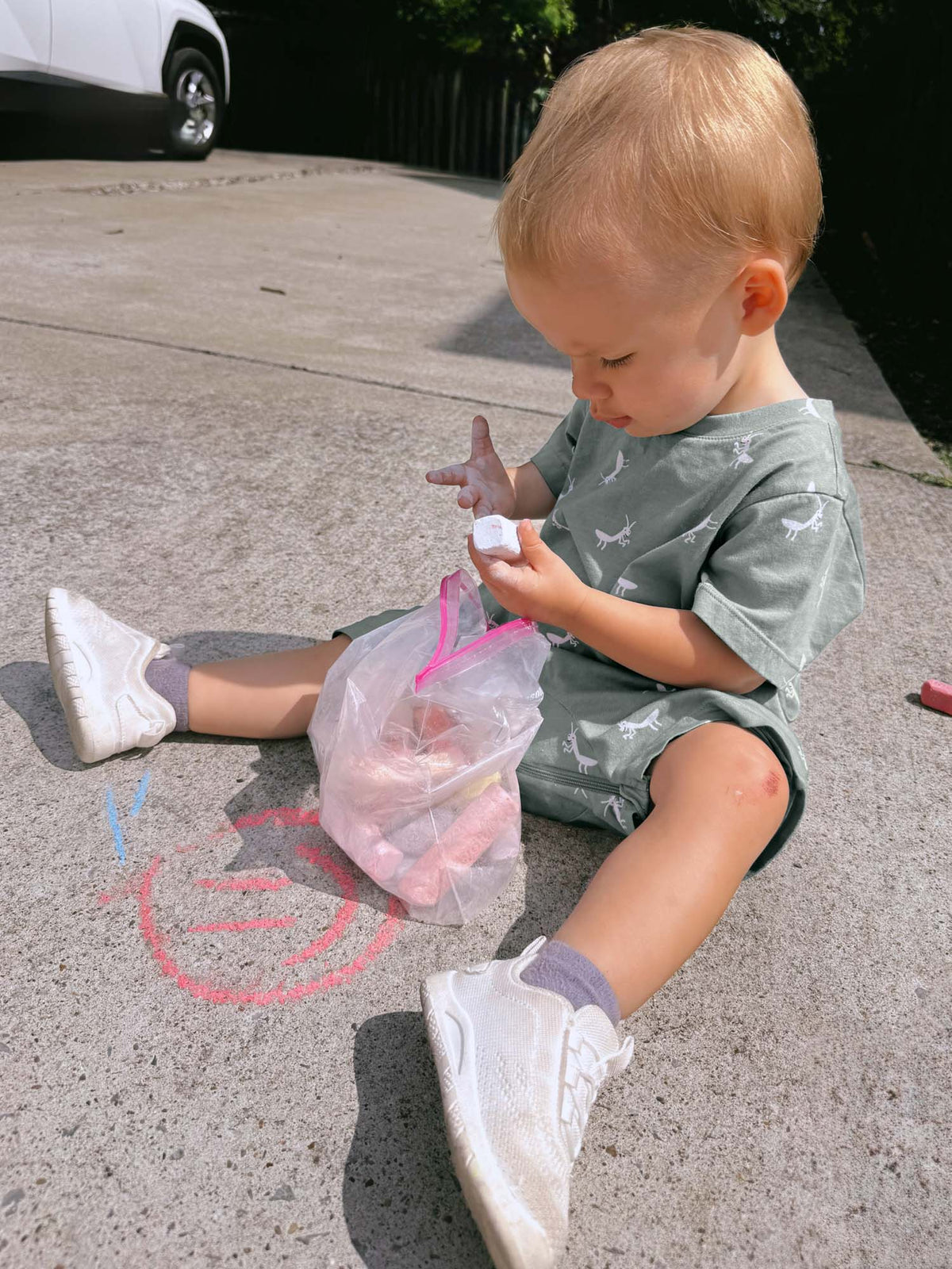 Sage green cotton short romper with white animal prints, crew neck and short legs