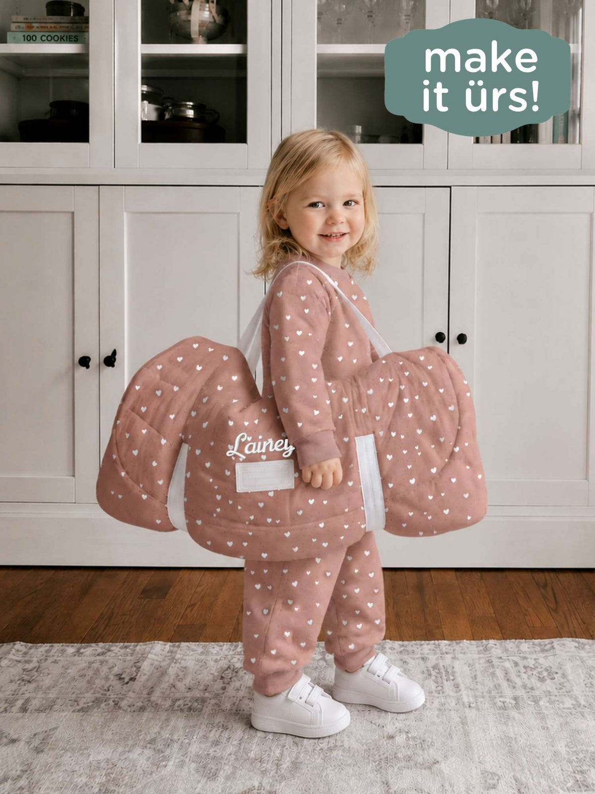 Hearts nap mat worn by child, dusty rose with white heart print