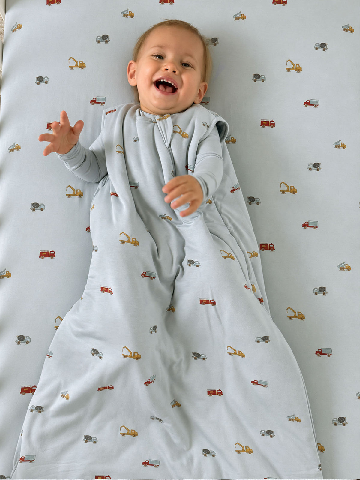 2.5 TOG baby sleep sack in light blue with vehicle pattern, long sleeves, front zipper