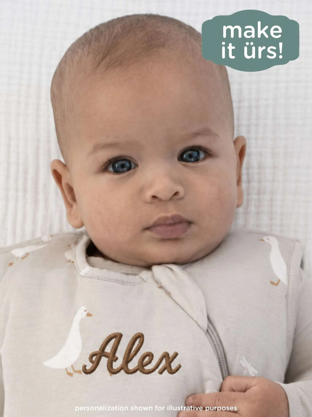 1.0 TOG goose print sleep sack, light gray; baby wearing it, front view
