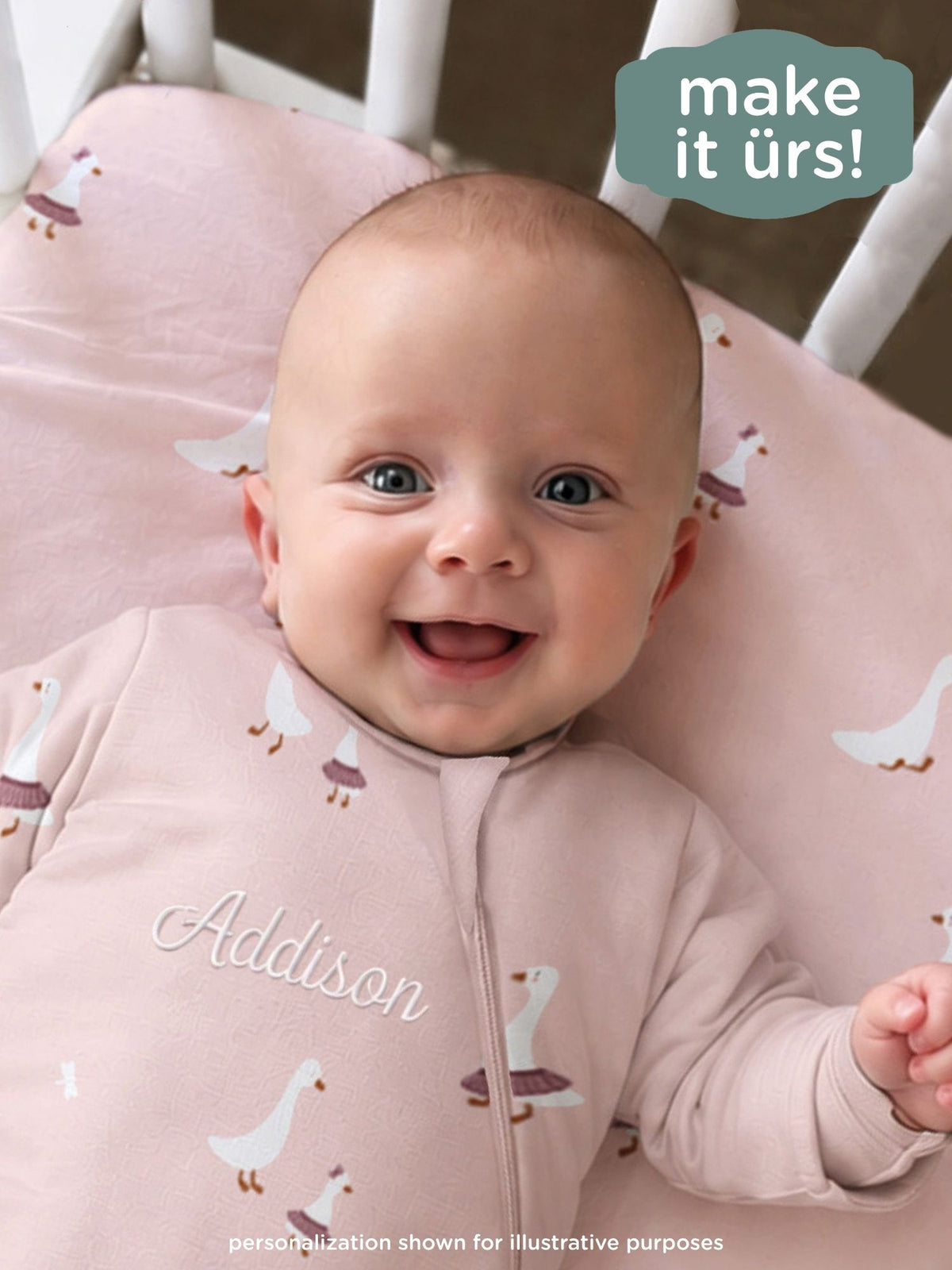 Pink long-sleeve sleep sack with duck print and front zipper, name text on front