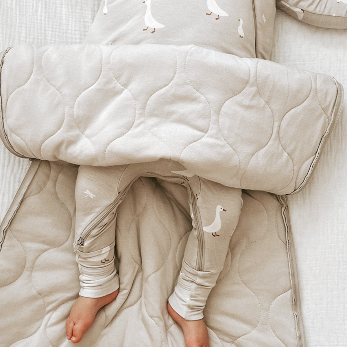 Quilted goose-print sleep sack with long sleeves and full-length zipper
