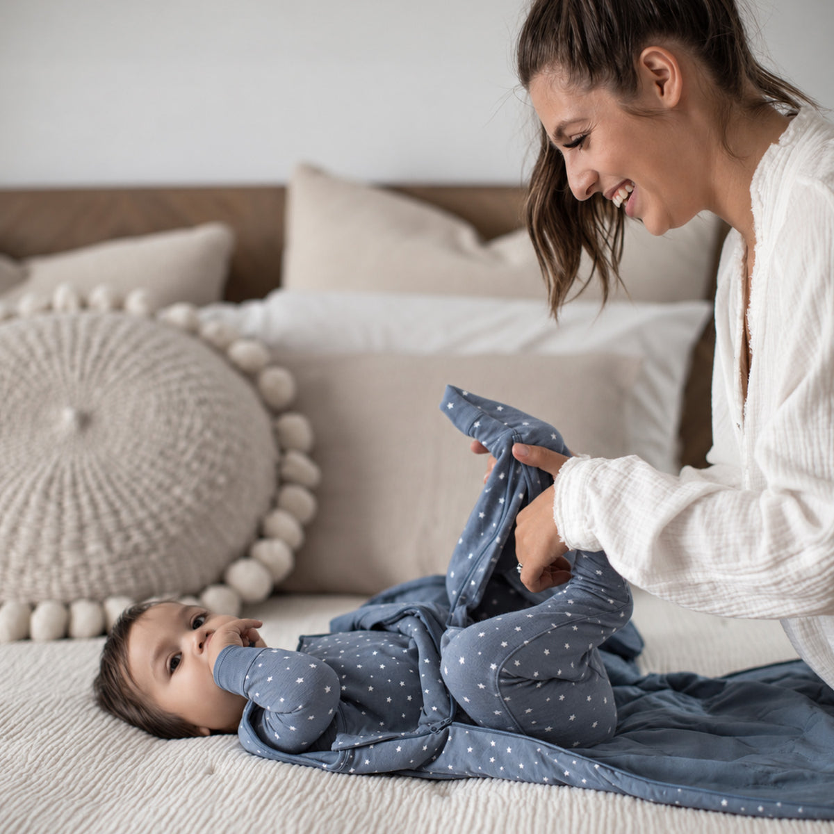 2.5 TOG blue star sleep sack with long sleeves, worn by baby while lying down