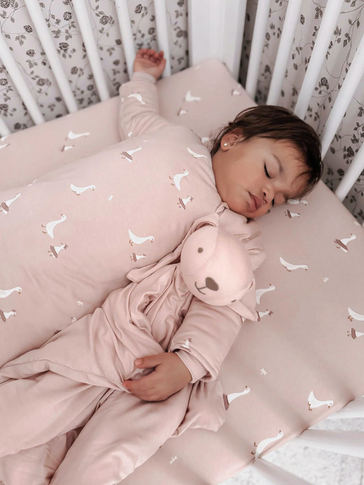 Blush pink swan-print long-sleeve sleep sack with front zipper