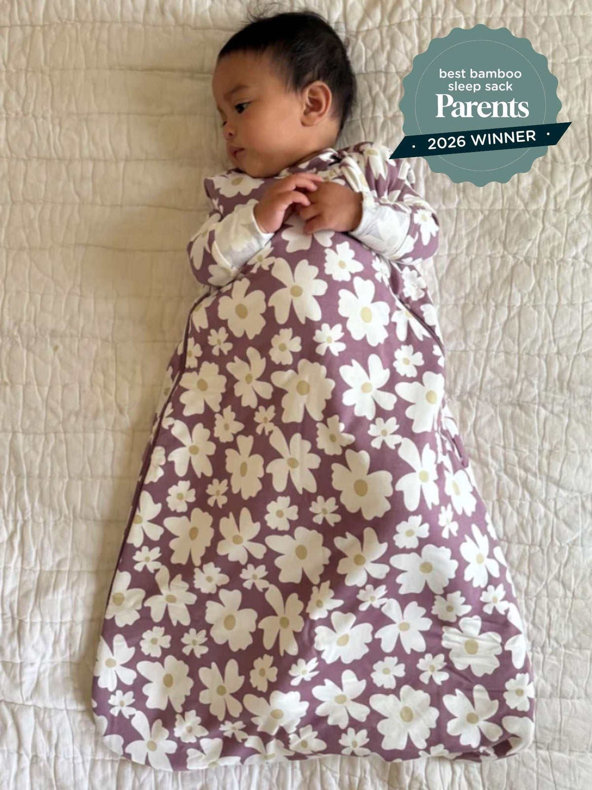 Floral sleep sack with maroon base and white flower print, front view