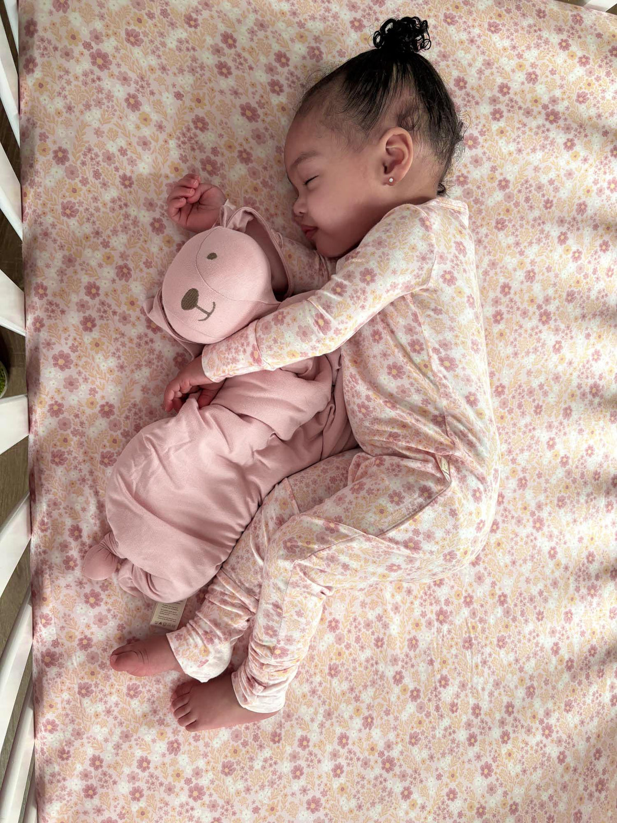 Floral long-sleeve convertible pajamas in sorbet pink, held close with plush face