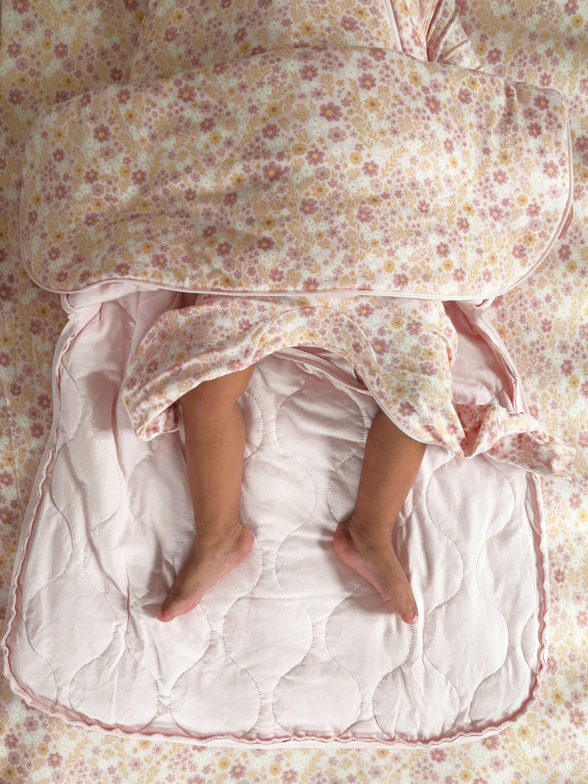 Floral sleep sack bottom with quilted interior and open leg area, light pink trim