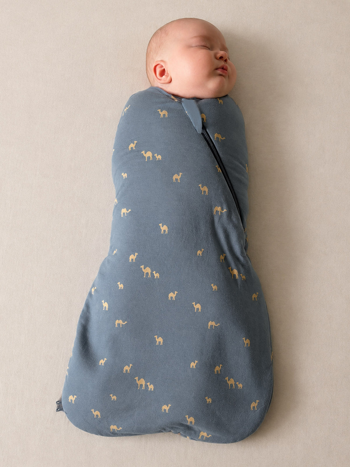 2.5 TOG swaddle sleep sack in blue with small camel pattern, front view