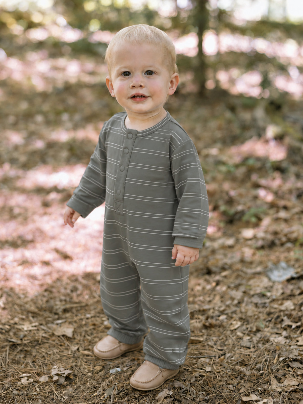 Gray striped henley jumpsuit with button placket, long sleeves and pant legs