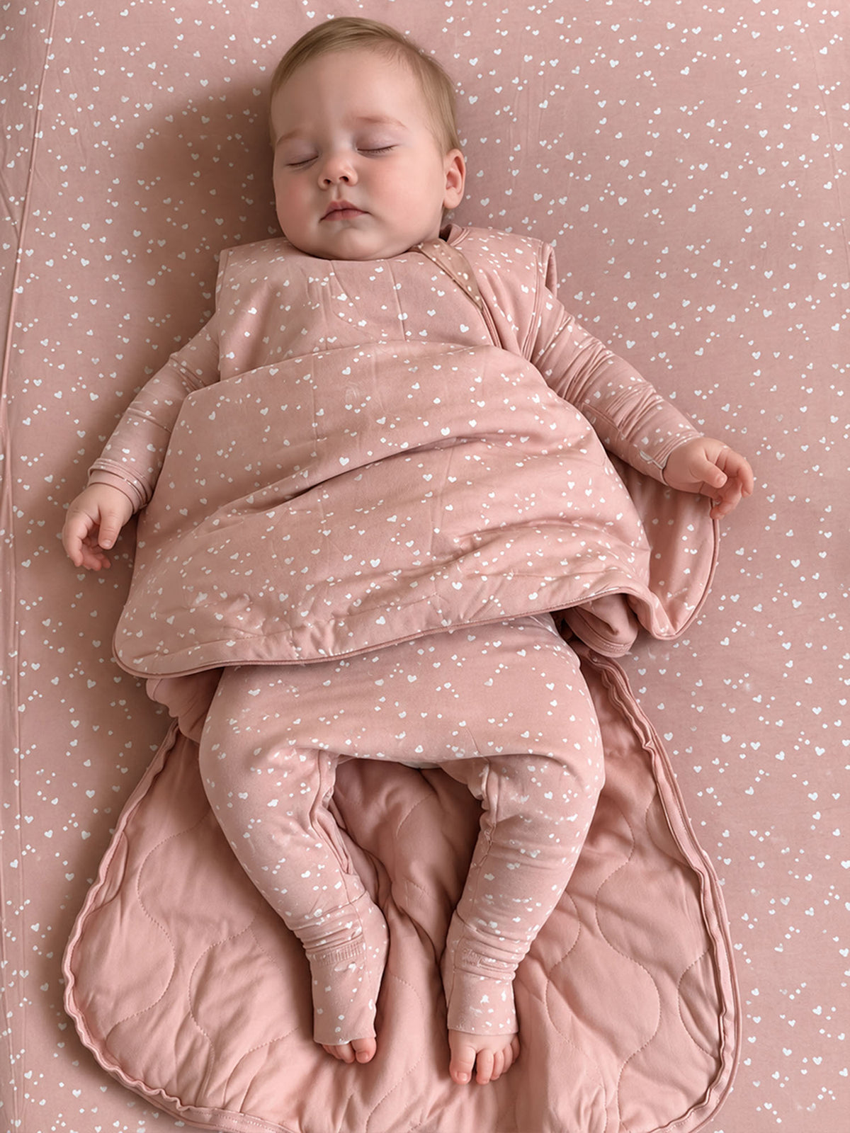 Pink 2.5 TOG baby sleep sack with heart print, long sleeves and zipper front