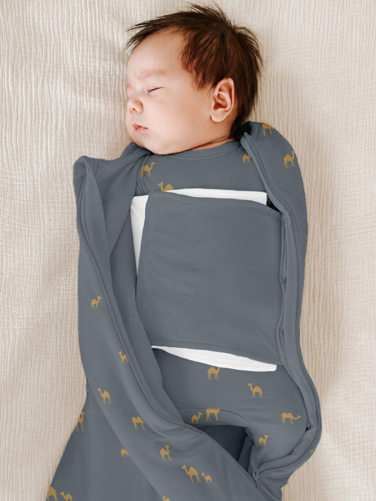 Blue 2.5 TOG sleep sack with camel print, open wrap flap showing padded insert