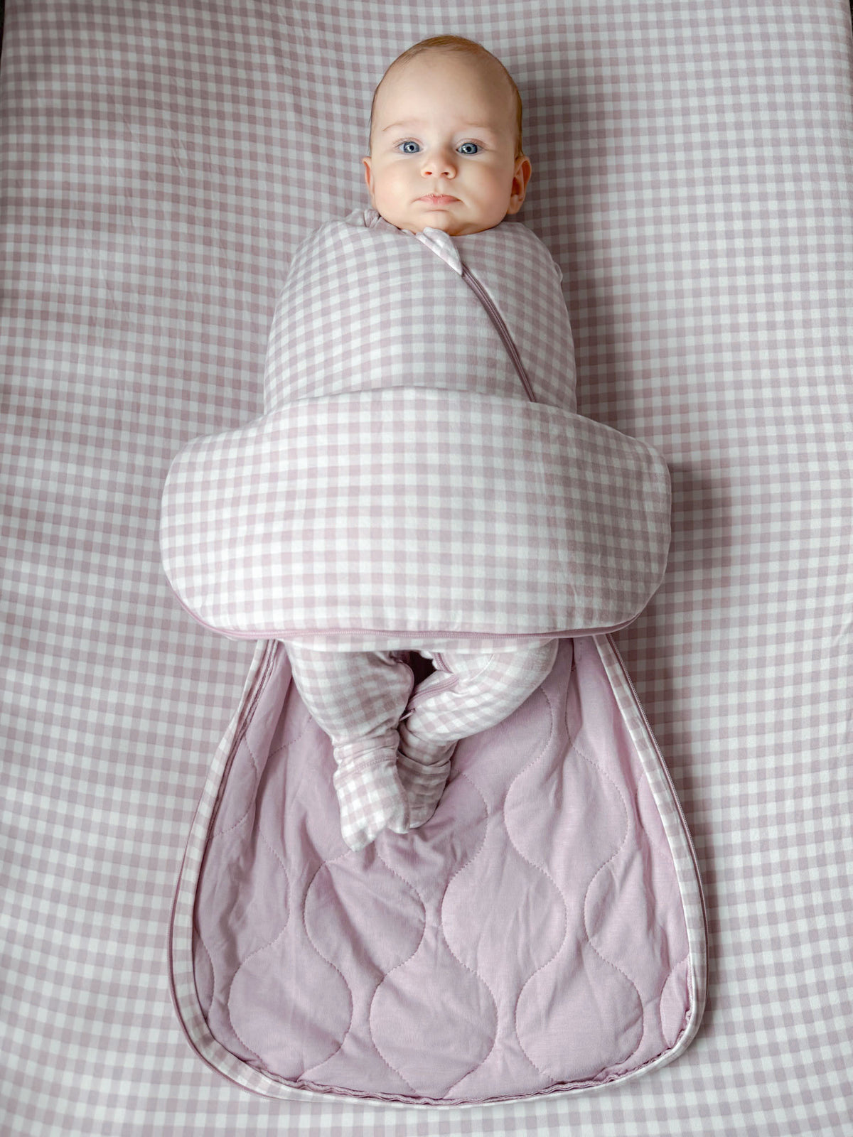 Gingham swaddle sleep sack with quilted inner lining and lavender edging