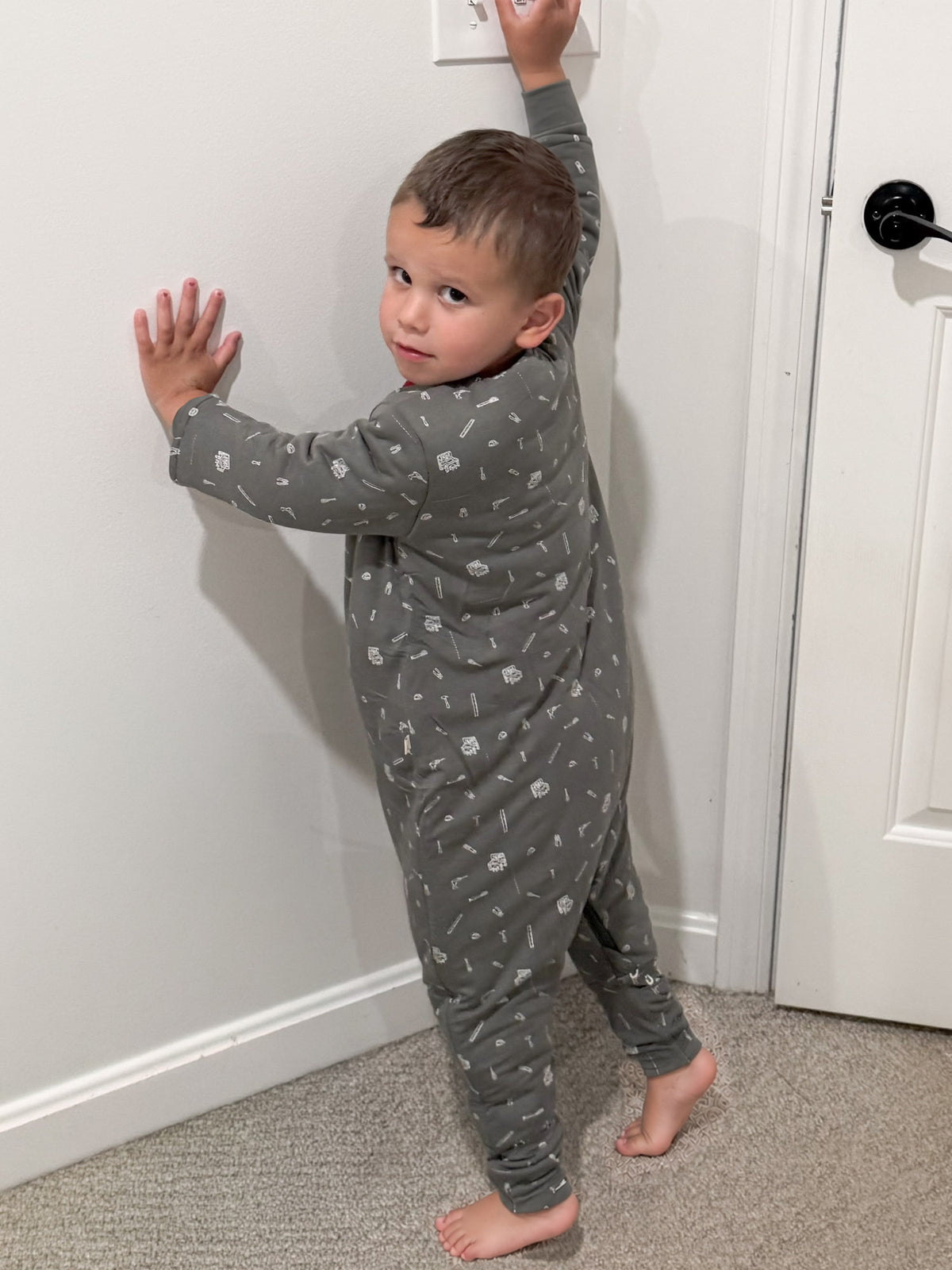 Gray footed sleep sack with white tool print, full-body zip front