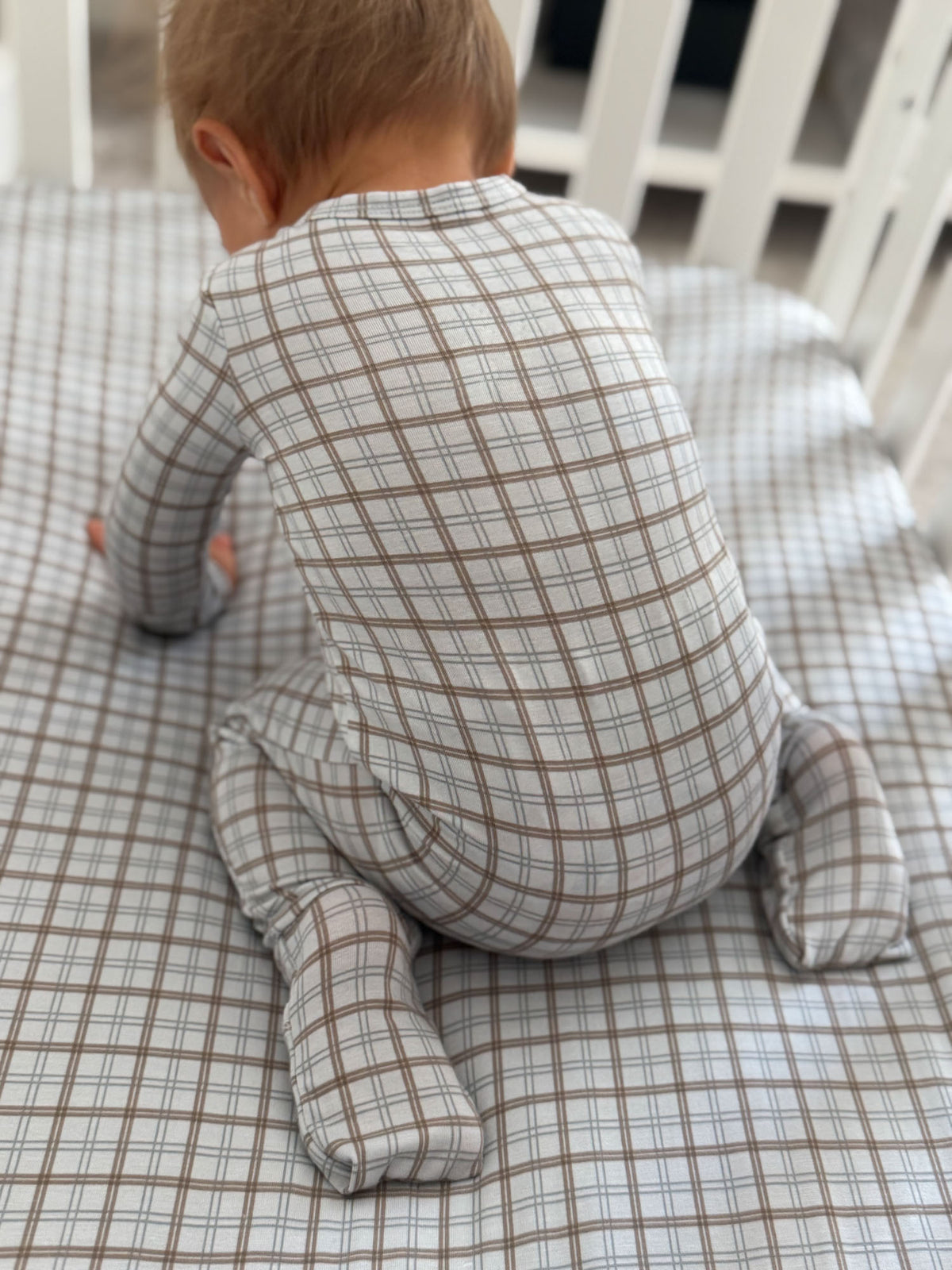 Cream plaid convertible pajama showing back, long sleeves and footed legs