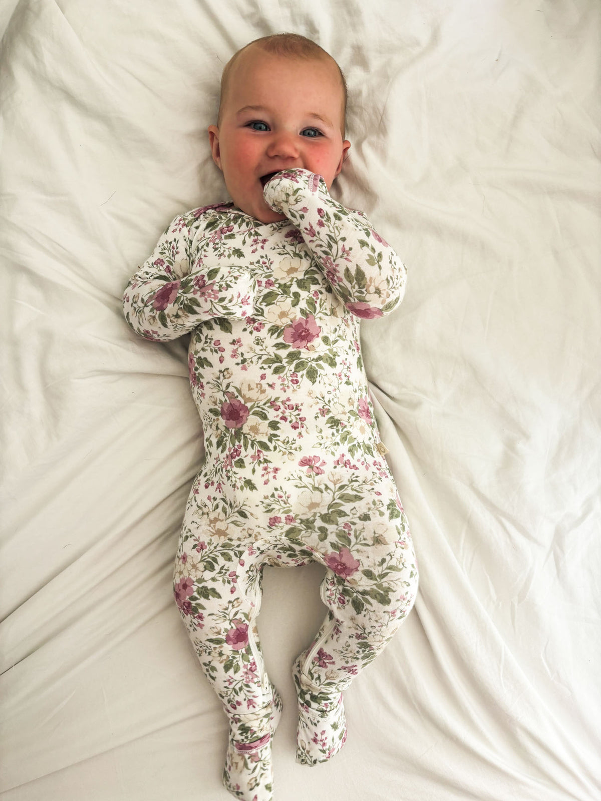 Baby floral convertible pajama with long sleeves and footed legs, full-body fit