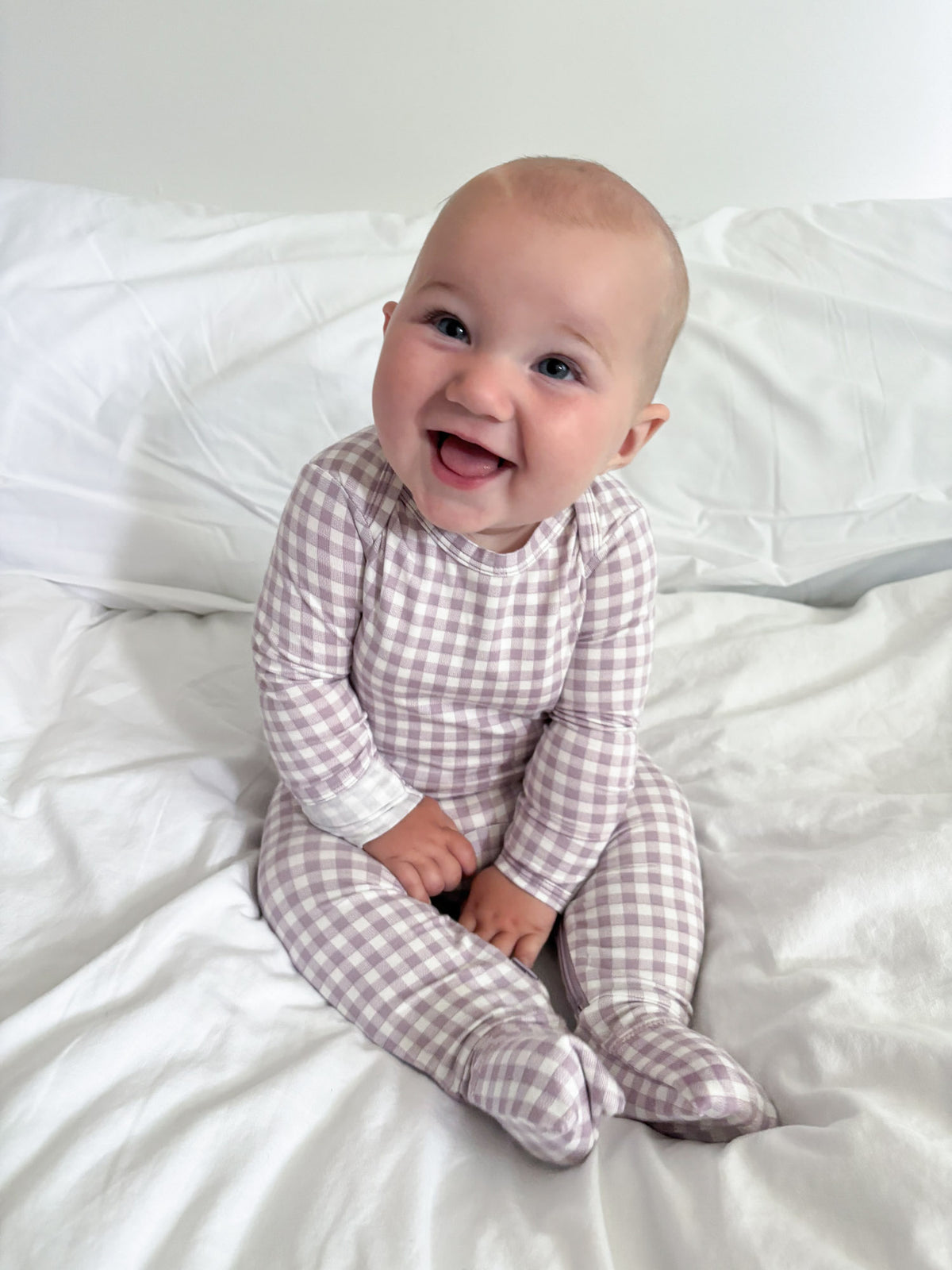 Gingham plaid baby pajama one-piece with long sleeves and closed feet