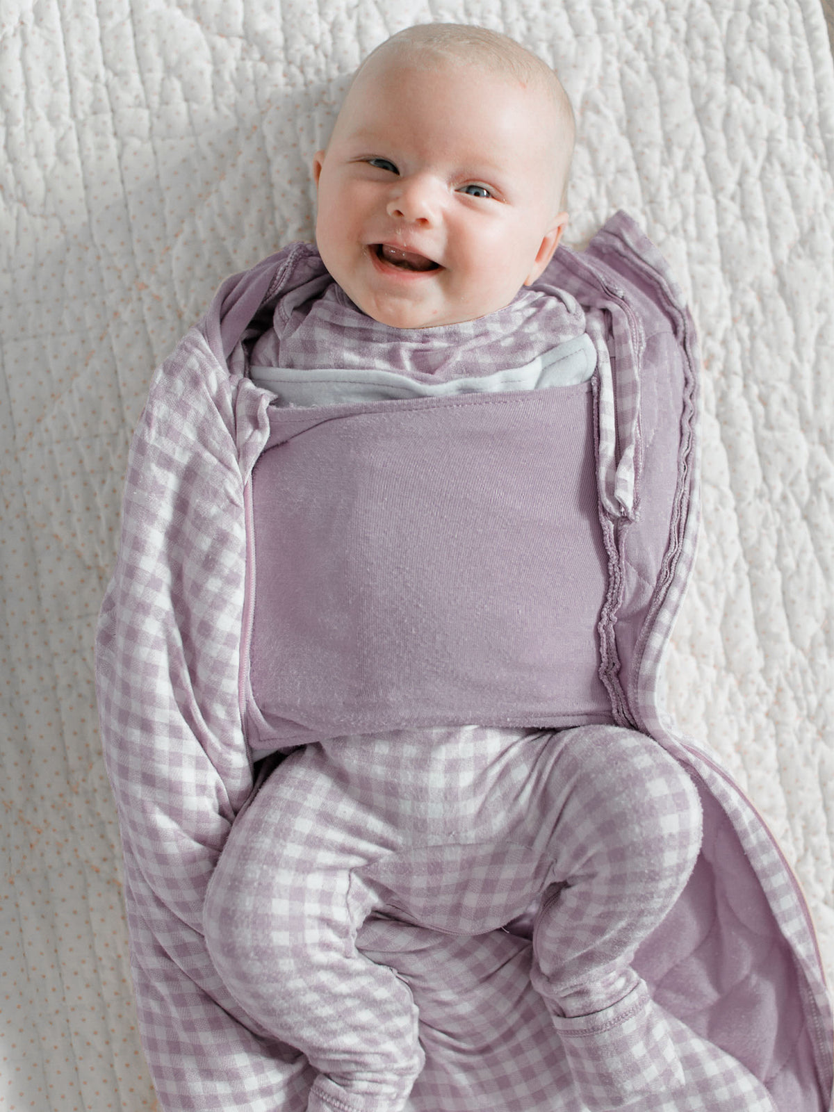 Lavender check swaddle sleep sack with front pouch and hooded neckline