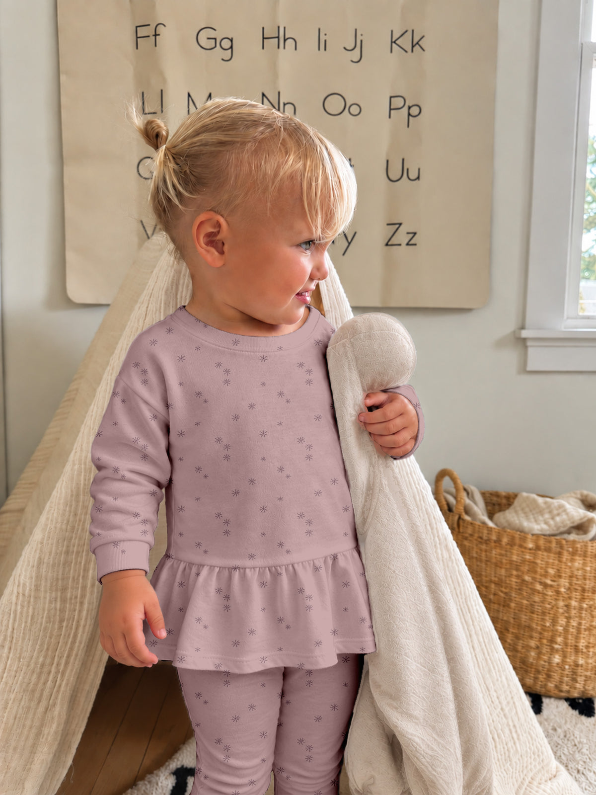 Lilac fleece ruffled tunic and leggings set with small dotted print, toddler side view