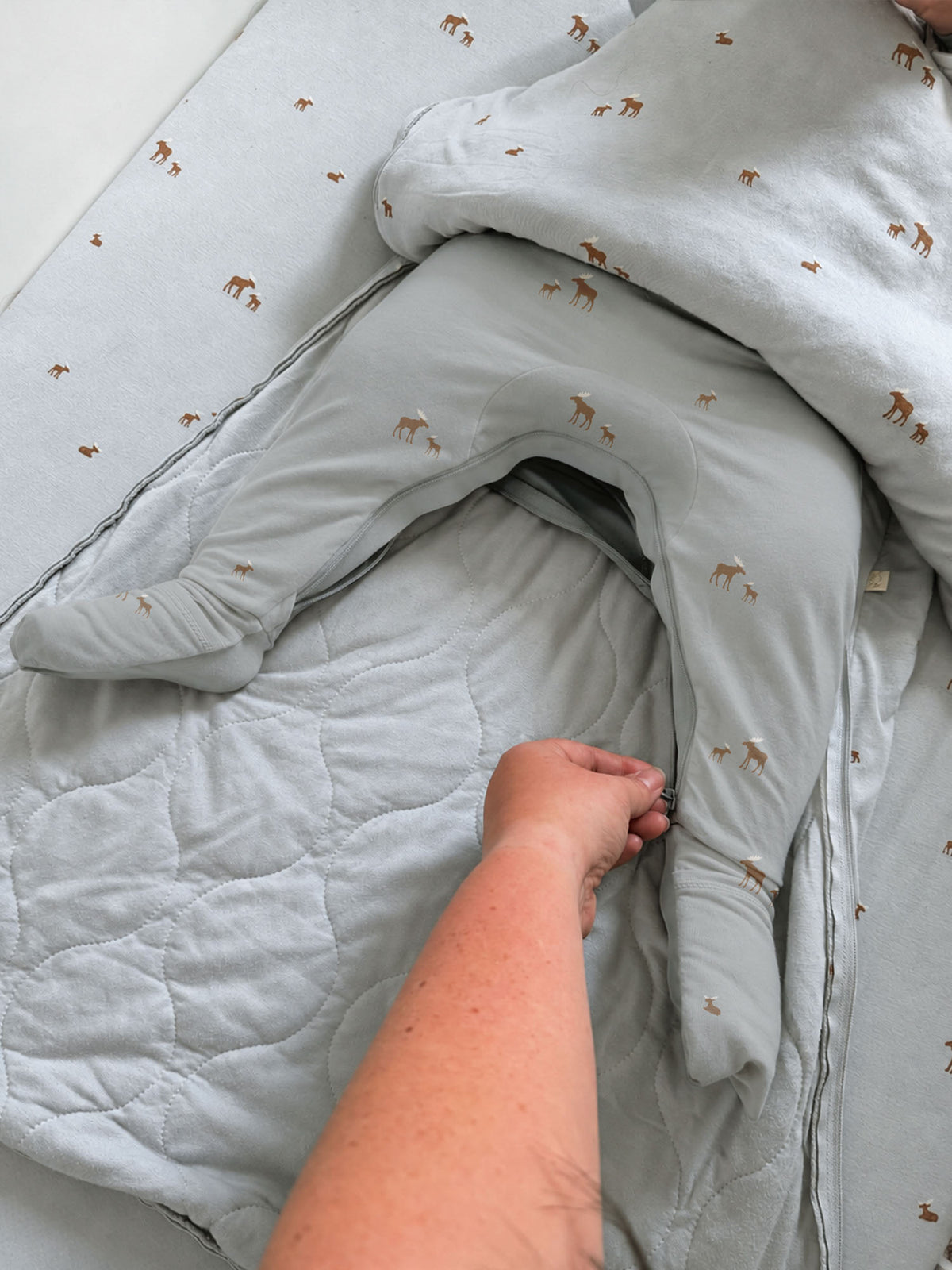 Light blue sleep sack with moose print, open view showing long sleeves and zipper