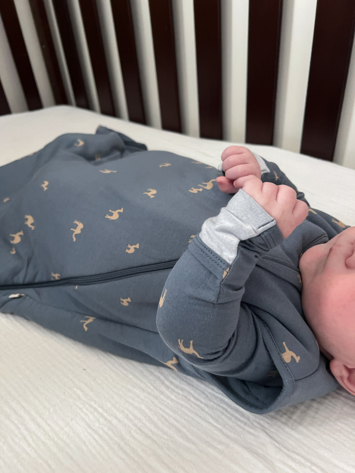Gray sleep sack with yellow camel pattern, full-length zipper and cuffs